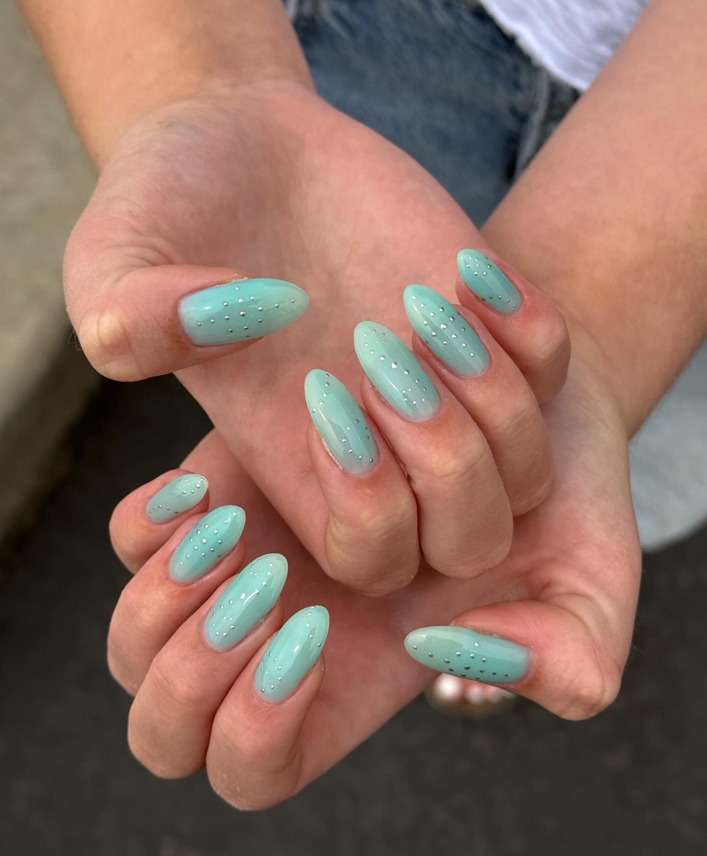 A studded turquoise manicure