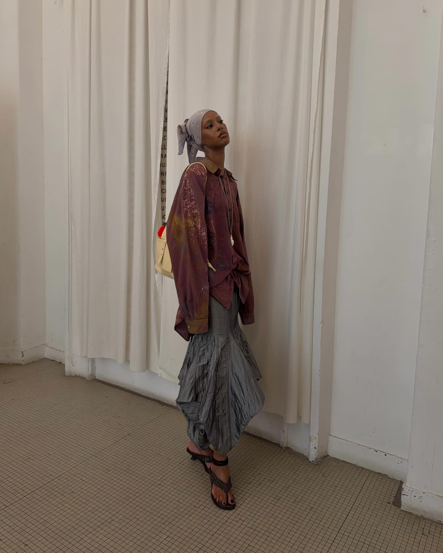 A woman wearing the thick-thong-sandal trend.