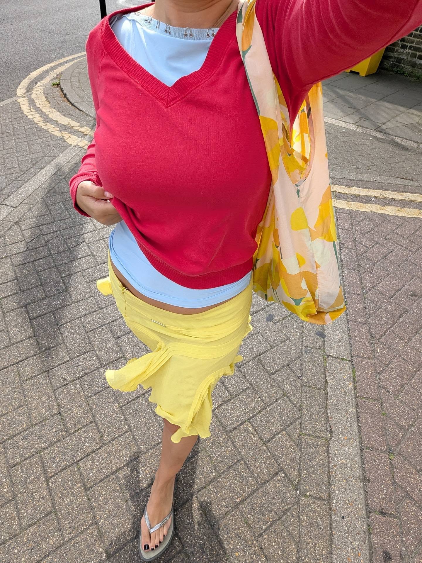 An image of a woman wearing asymmetric skirt outfit summer 2026