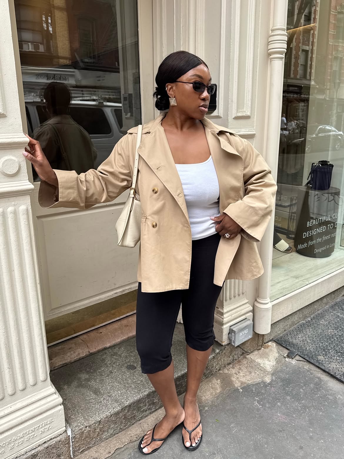 Nnena in a cropped khaki trench.