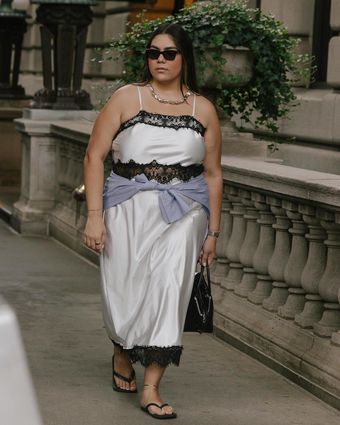Woman wearing summer dress with flip-flops.