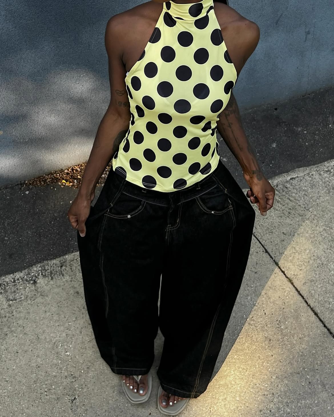 Aude-Julie Alingue in a polka dot top and jeans