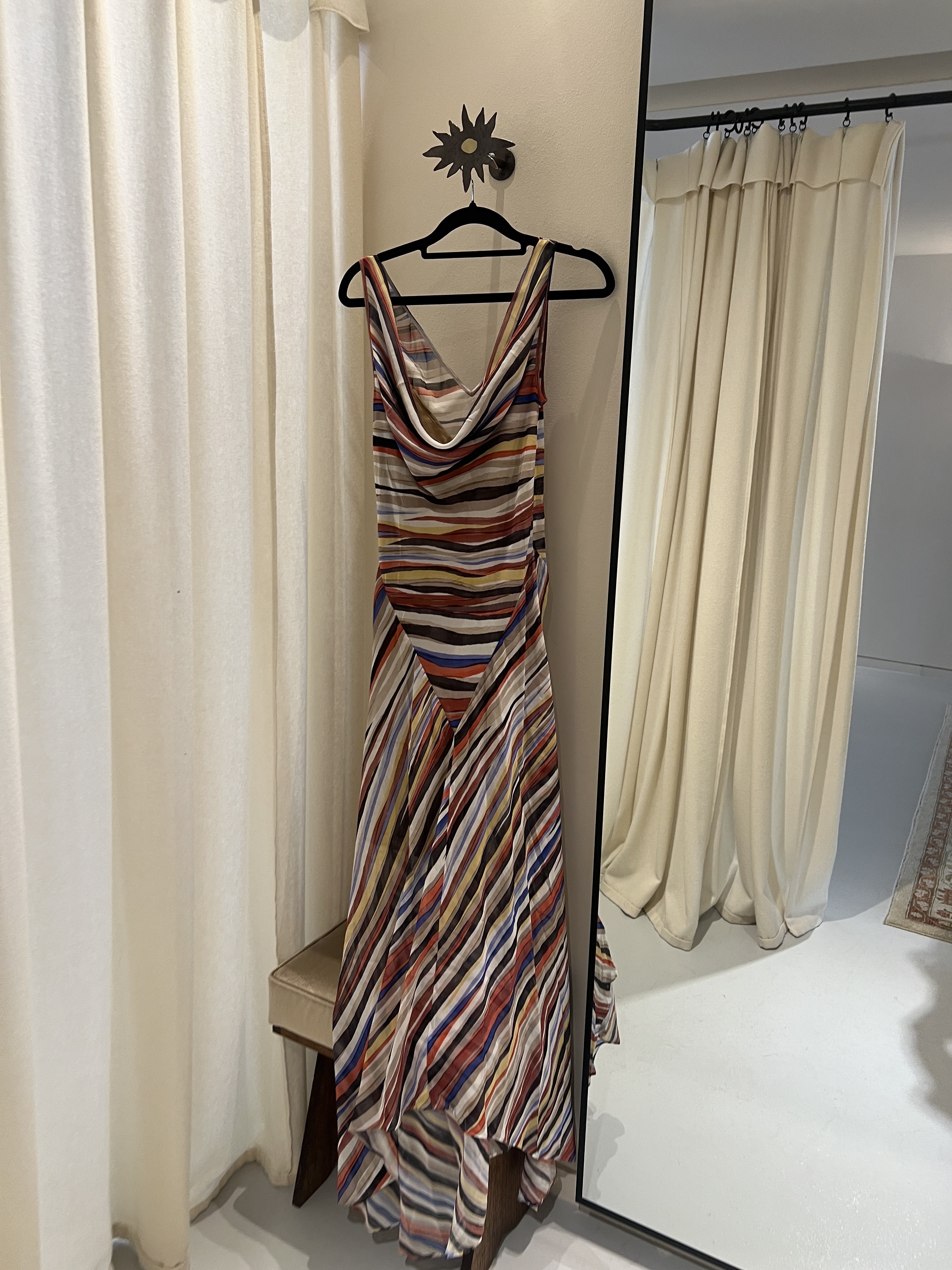 An image of the Realisation Par Cora dress hanging up in the brand's Belgravia boutique before fashion writer Ava Gilchrist tried it on.