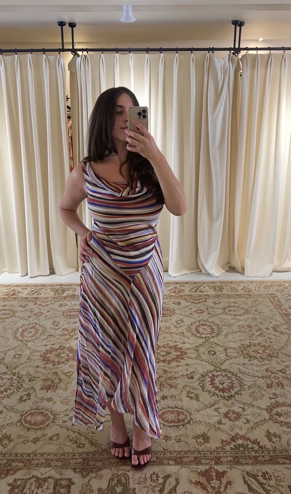 An image of Who What Wear fashion writer Ava Gilchrist wearing the Realisation Par Cora dress in Mirage. She is usually a size 10 and is wearing it in a M.