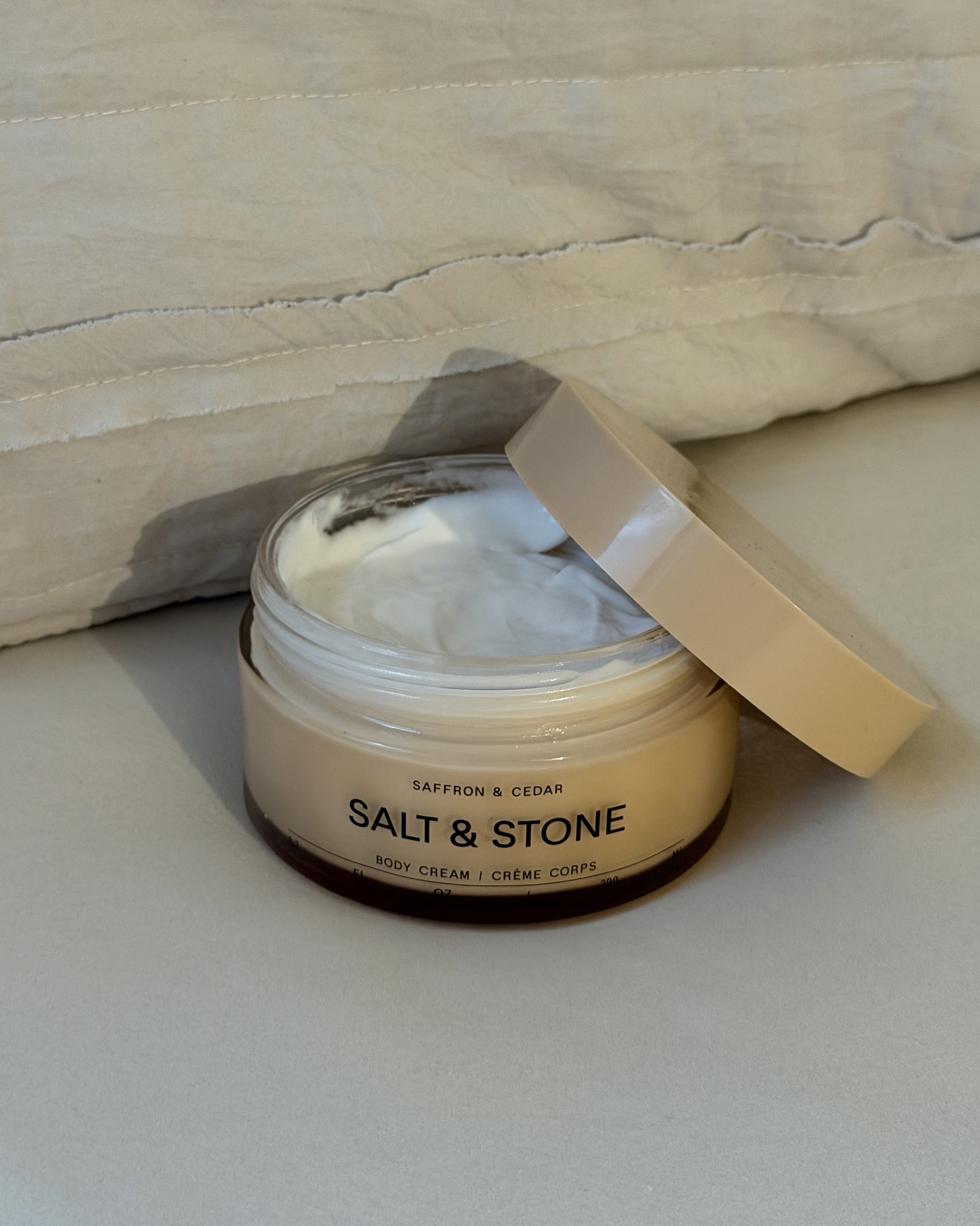 An image of associate beauty editor Alyssa Brascia's Salt & Stone Saffron and Cedar Body Cream.