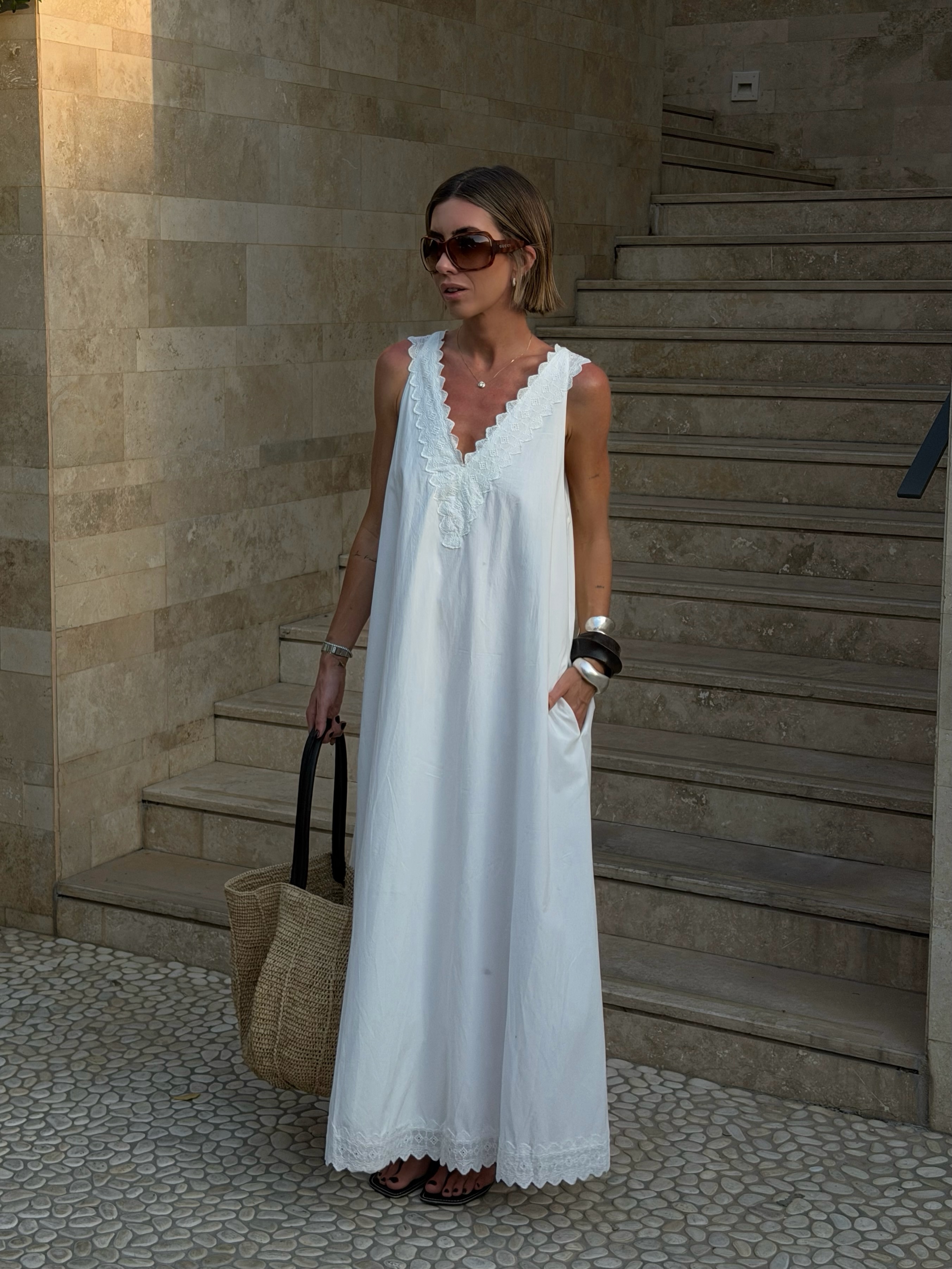 Hannah in white sundress with basket tote