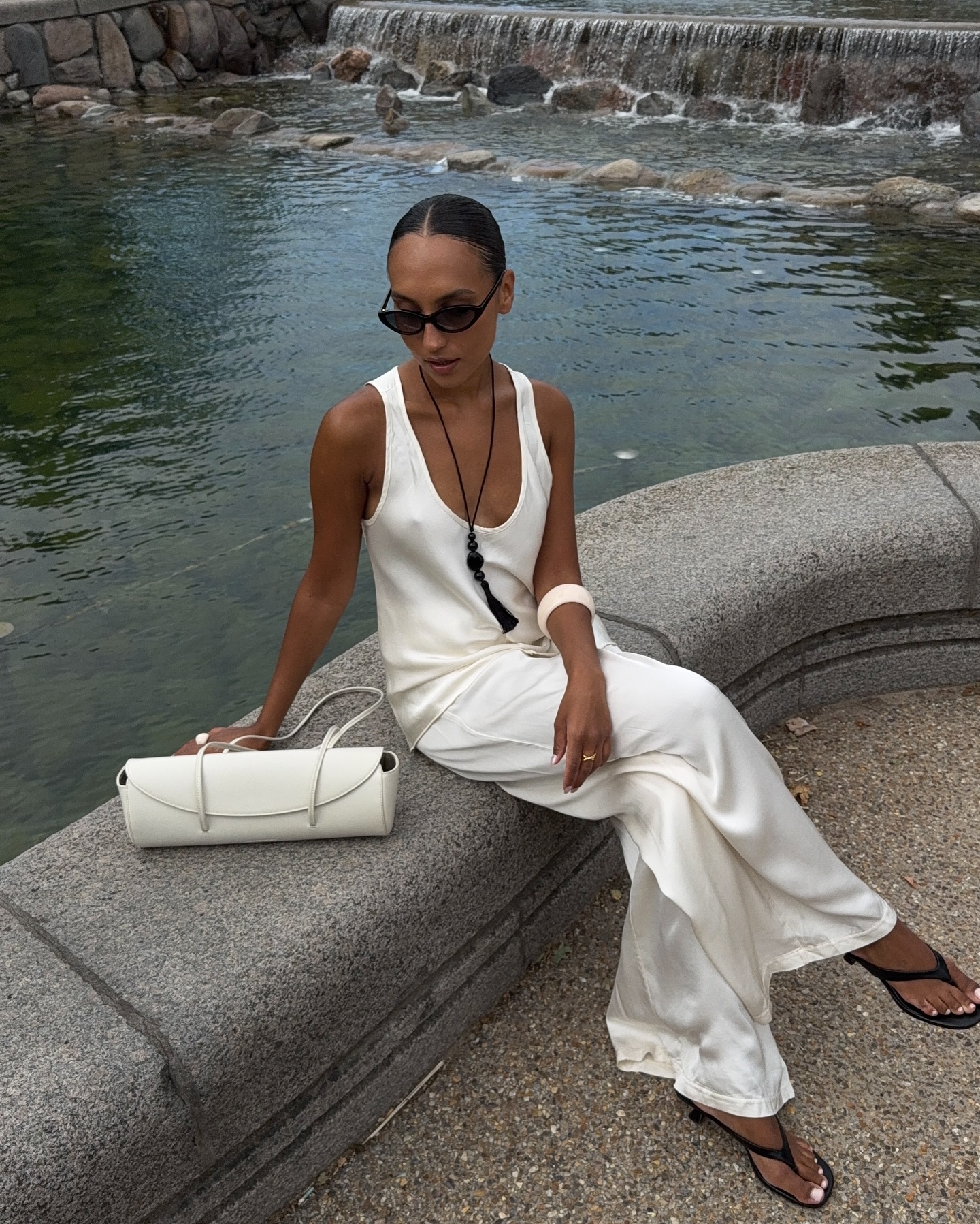 Ingrid in white satin trousers and stop