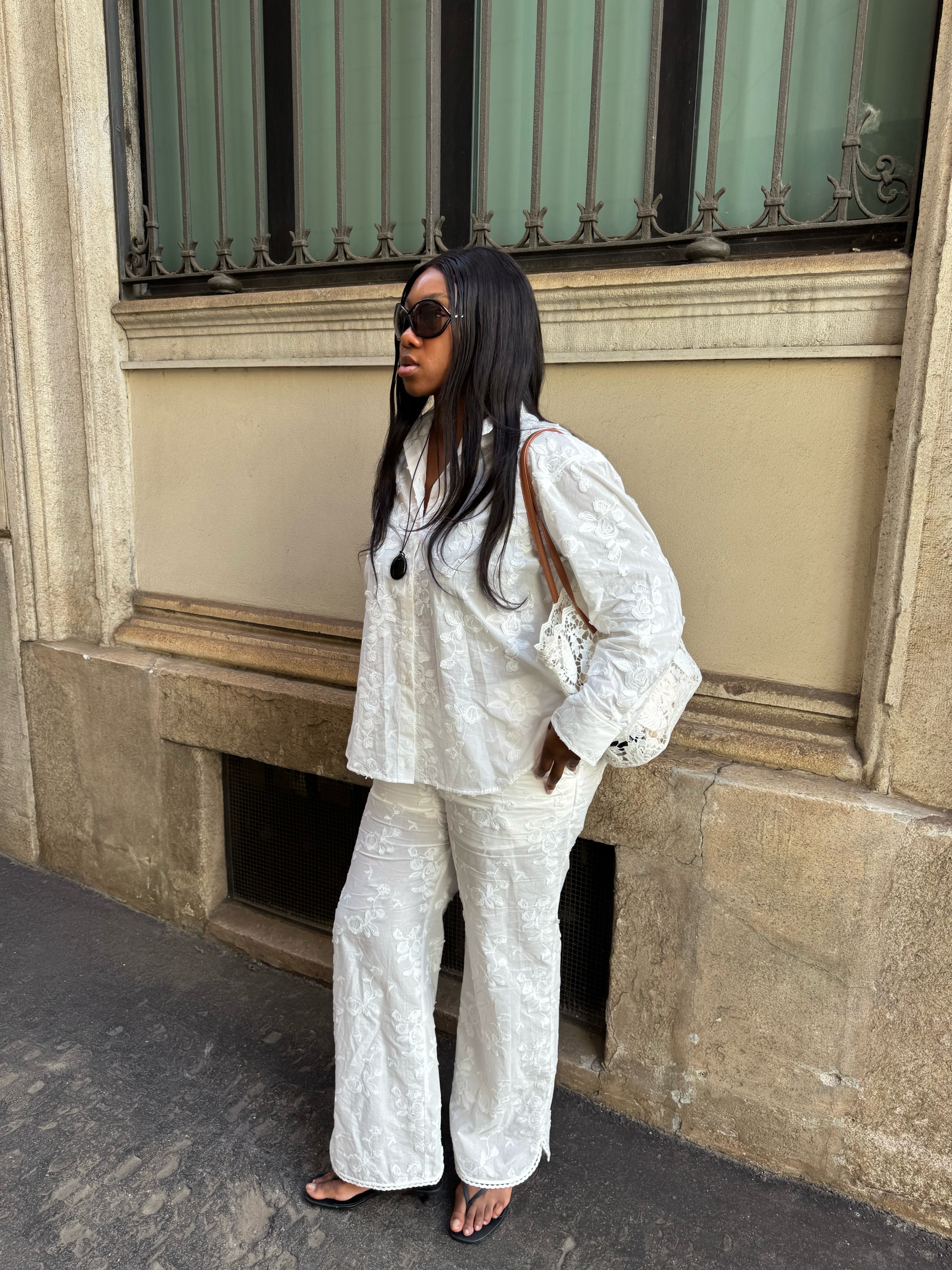 Nnenna in white embroidered top and trousers