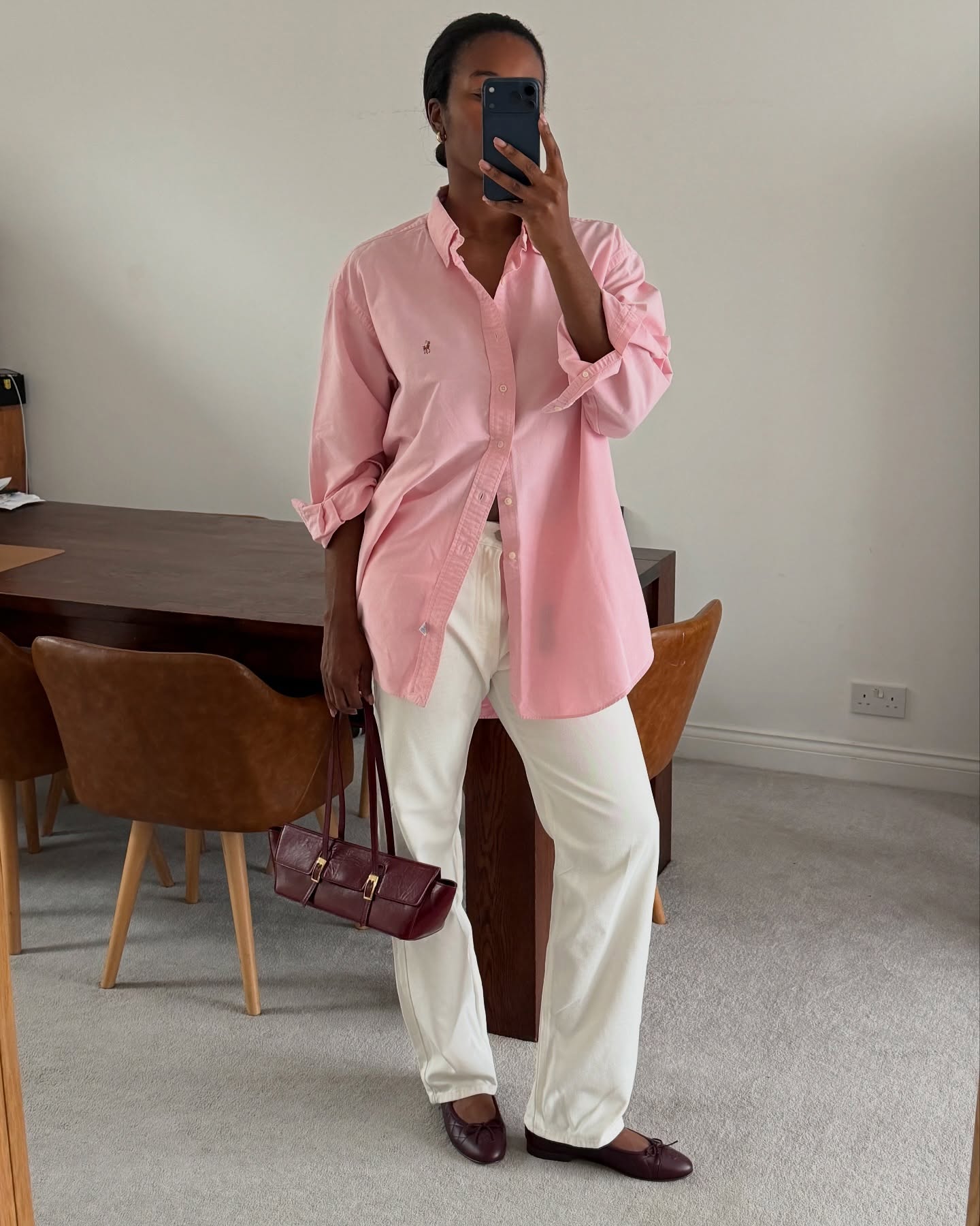 Marilyn in pink button-down and white jeans