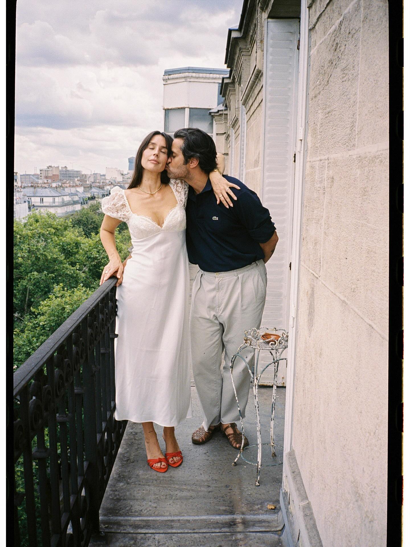 Pia Baroncini in a white LPA dress and red heels.