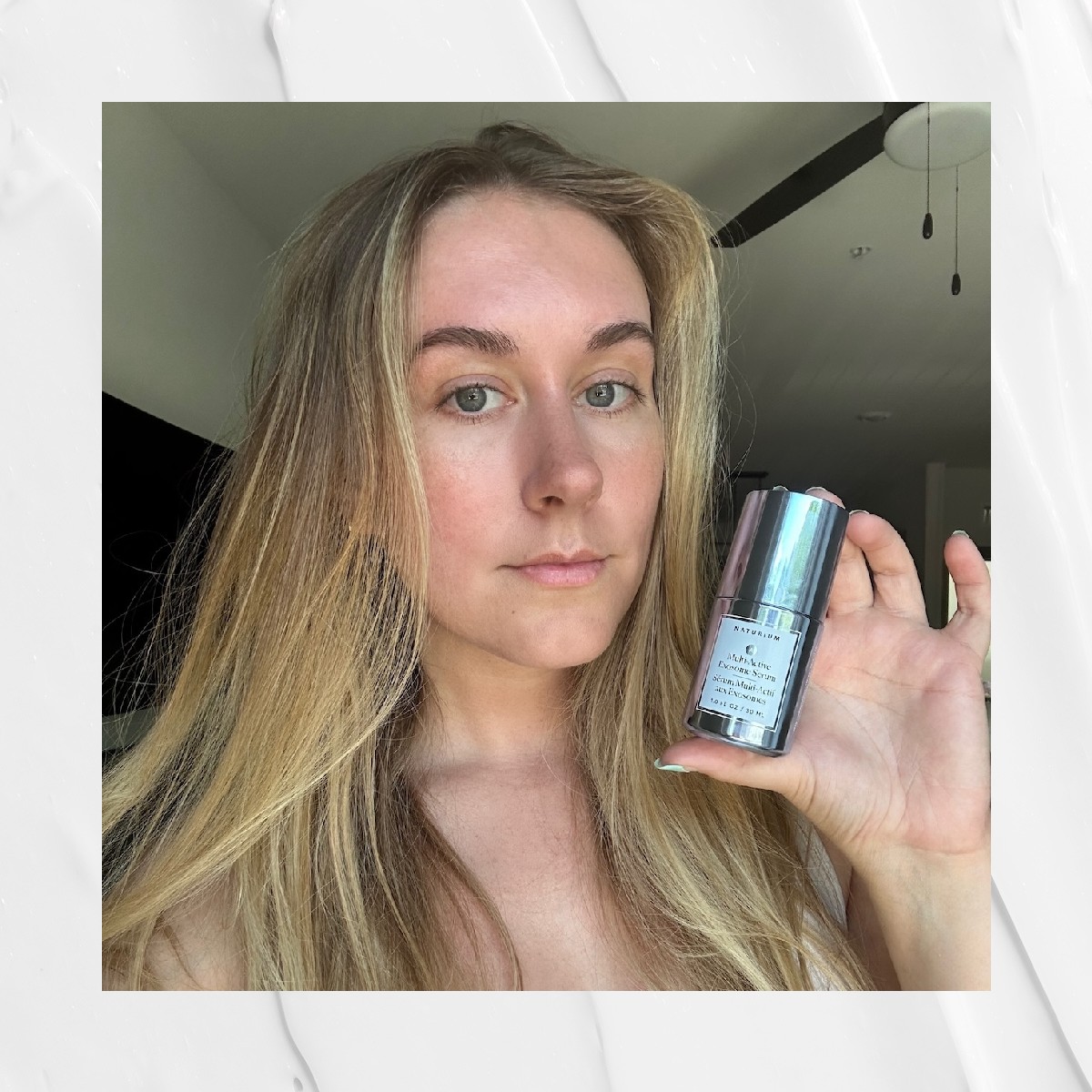 Beauty editor Kaitlyn McLintock holding Naturium's Mult-Active Exosome Serum