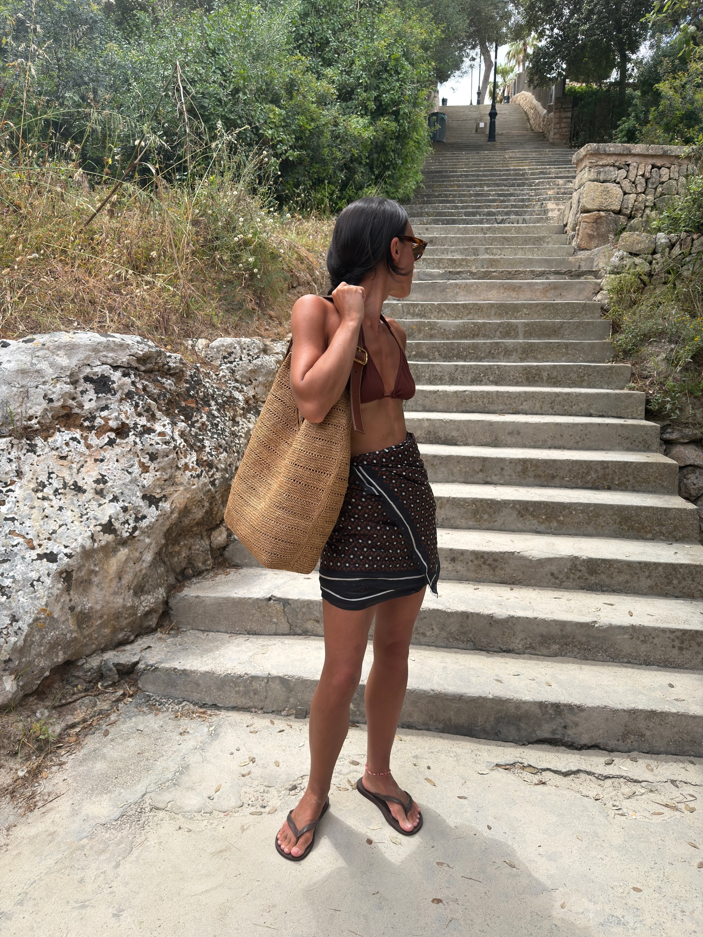 An image of @emswells wearing a butter brown bikini, one of the biggest bikini colour trends of 2026.
