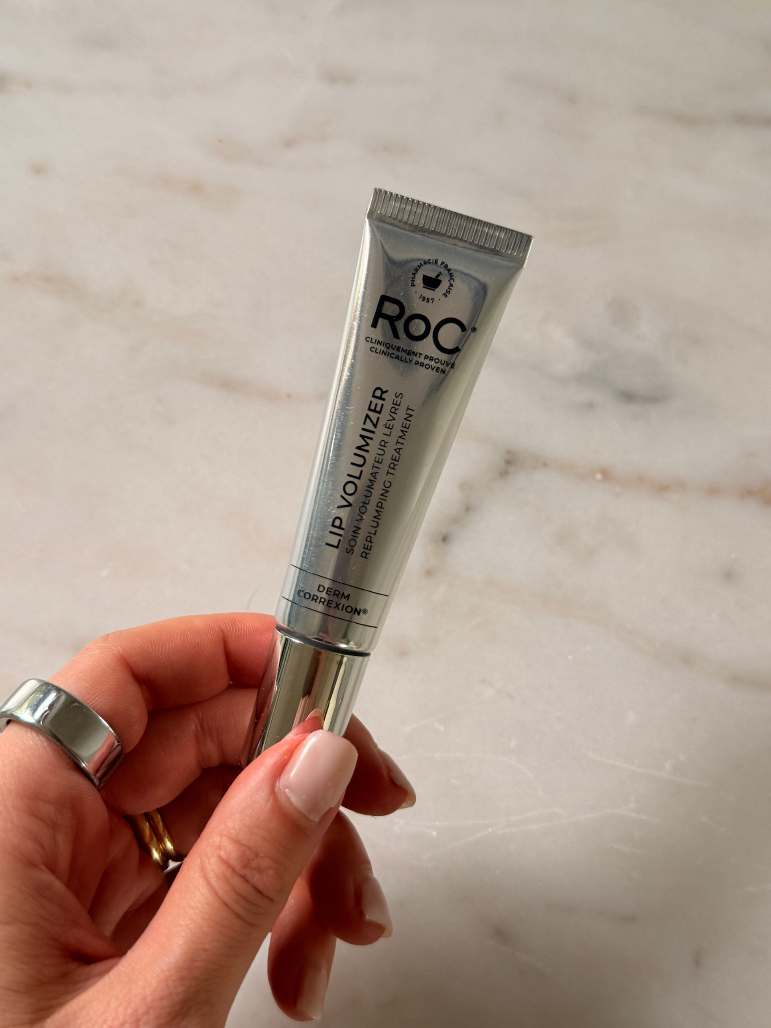Grace holding the RoC Lip Balm