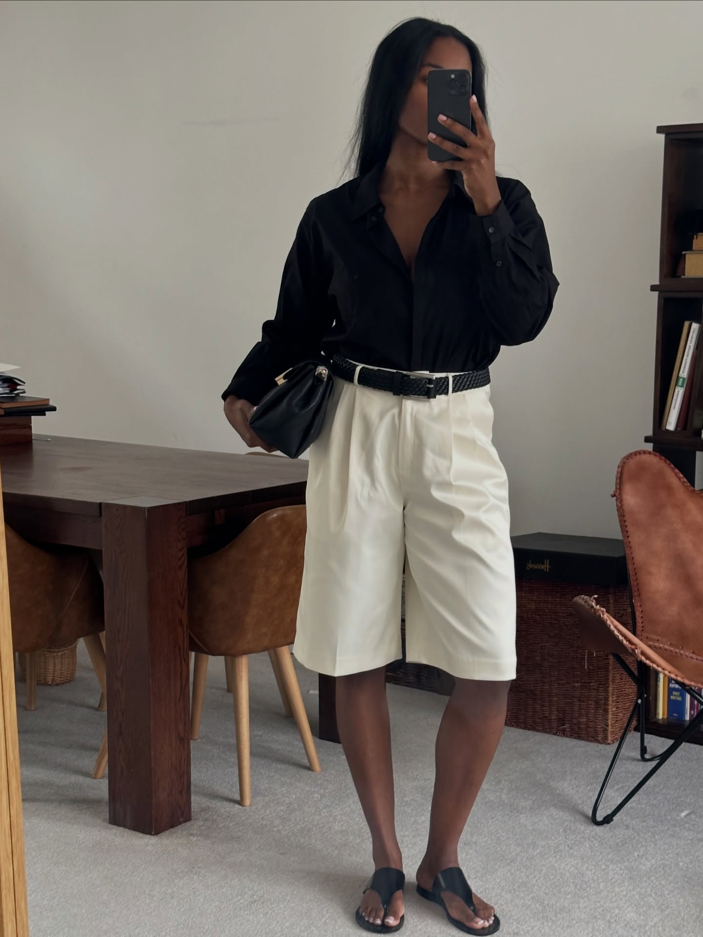 Marilyn in black shirt and cream Bermuda shorts
