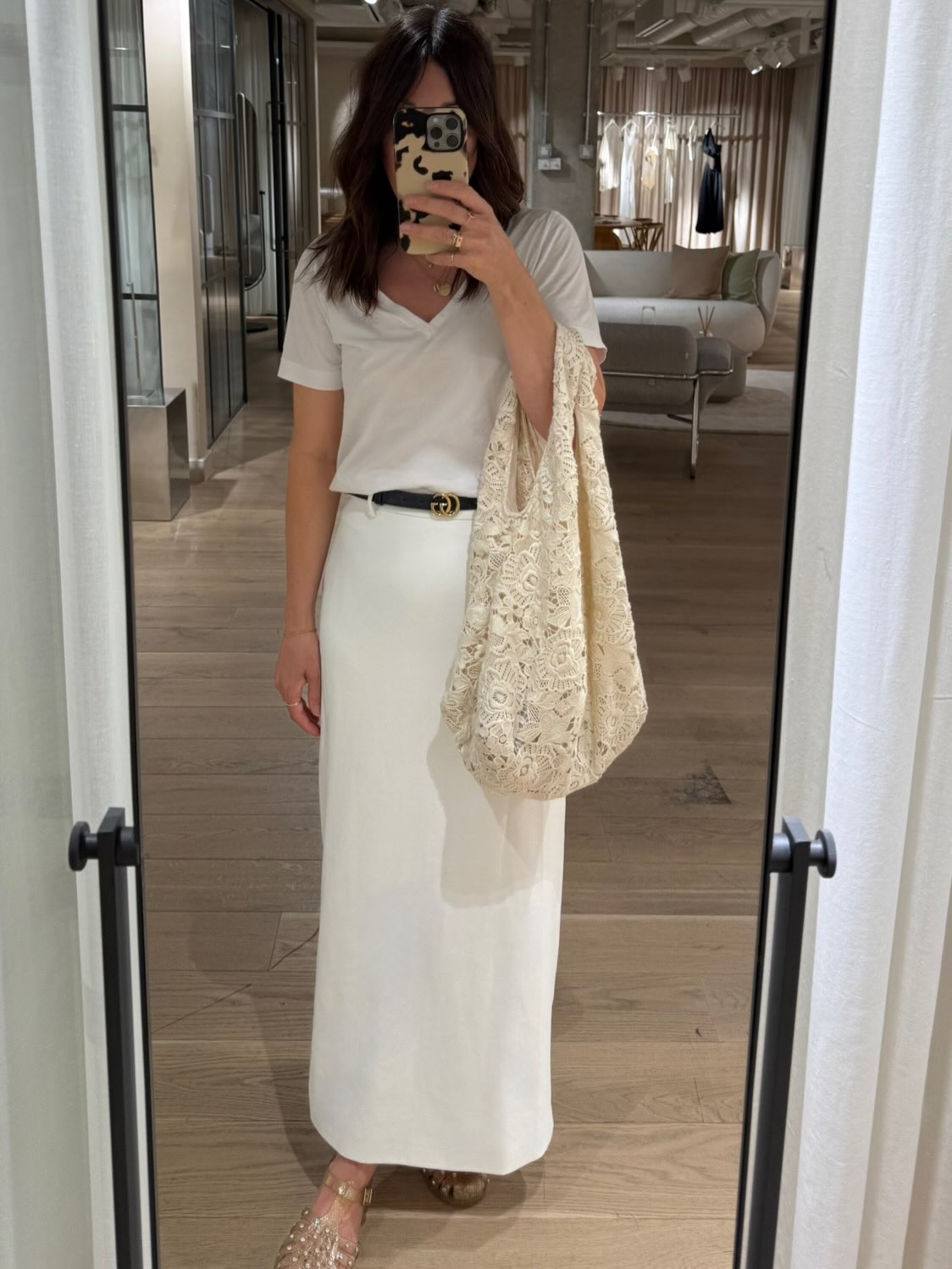 Influencer Claire Wakeman wearing a white column skirt.