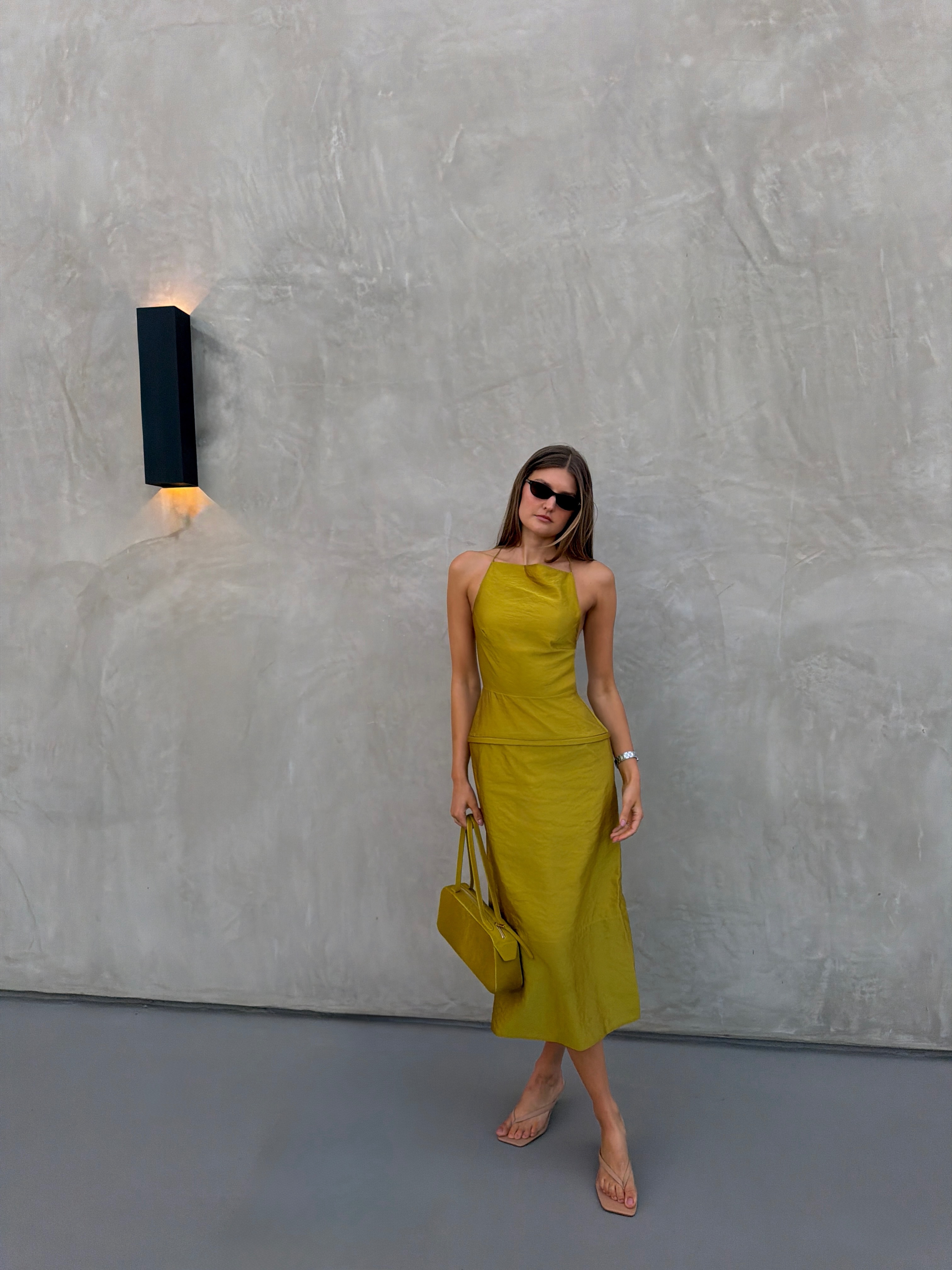A woman wearing light-latte shoes in summer 2026.