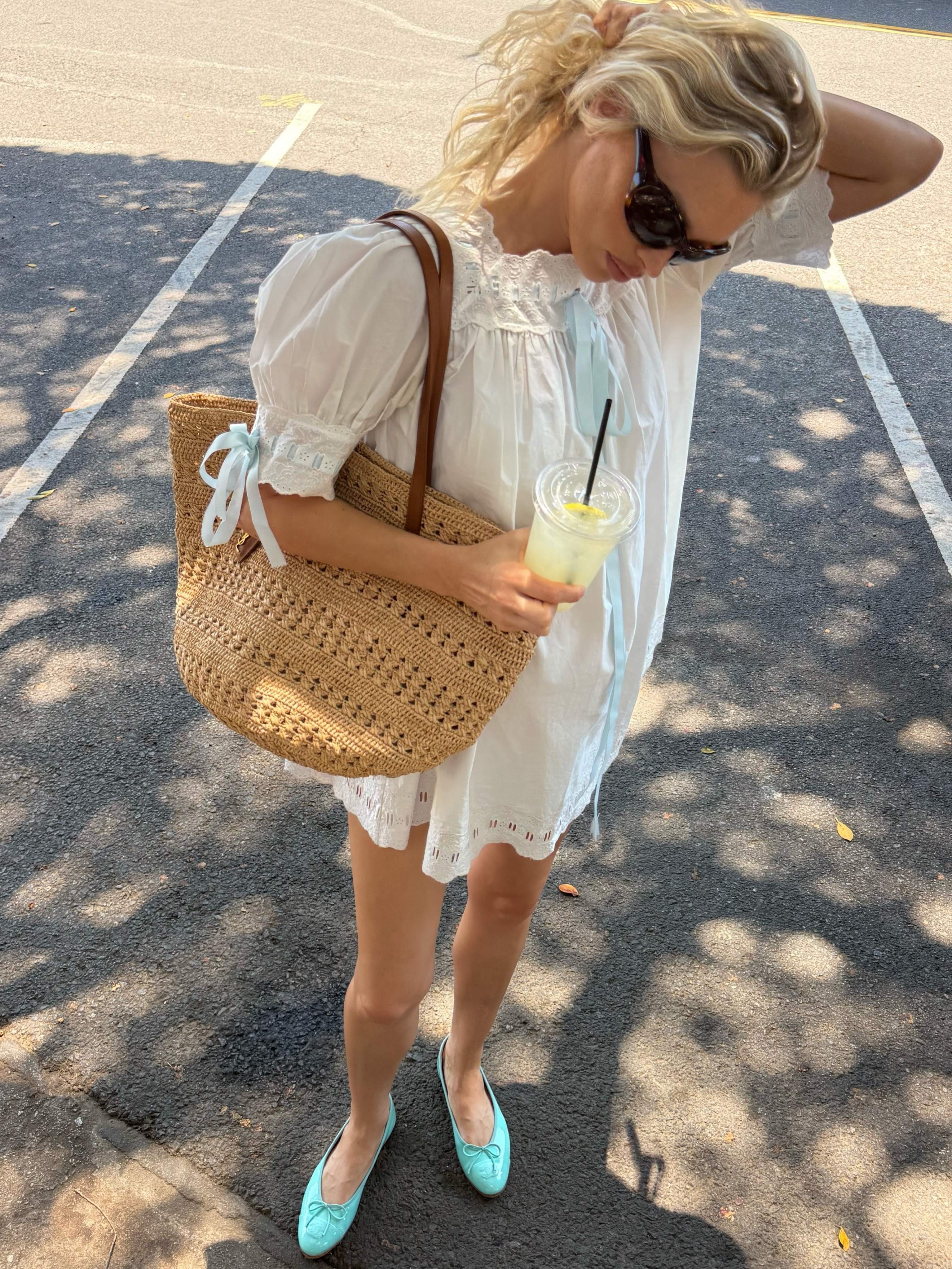 Elsa hosk wearing Saint Laurent Raffia bag