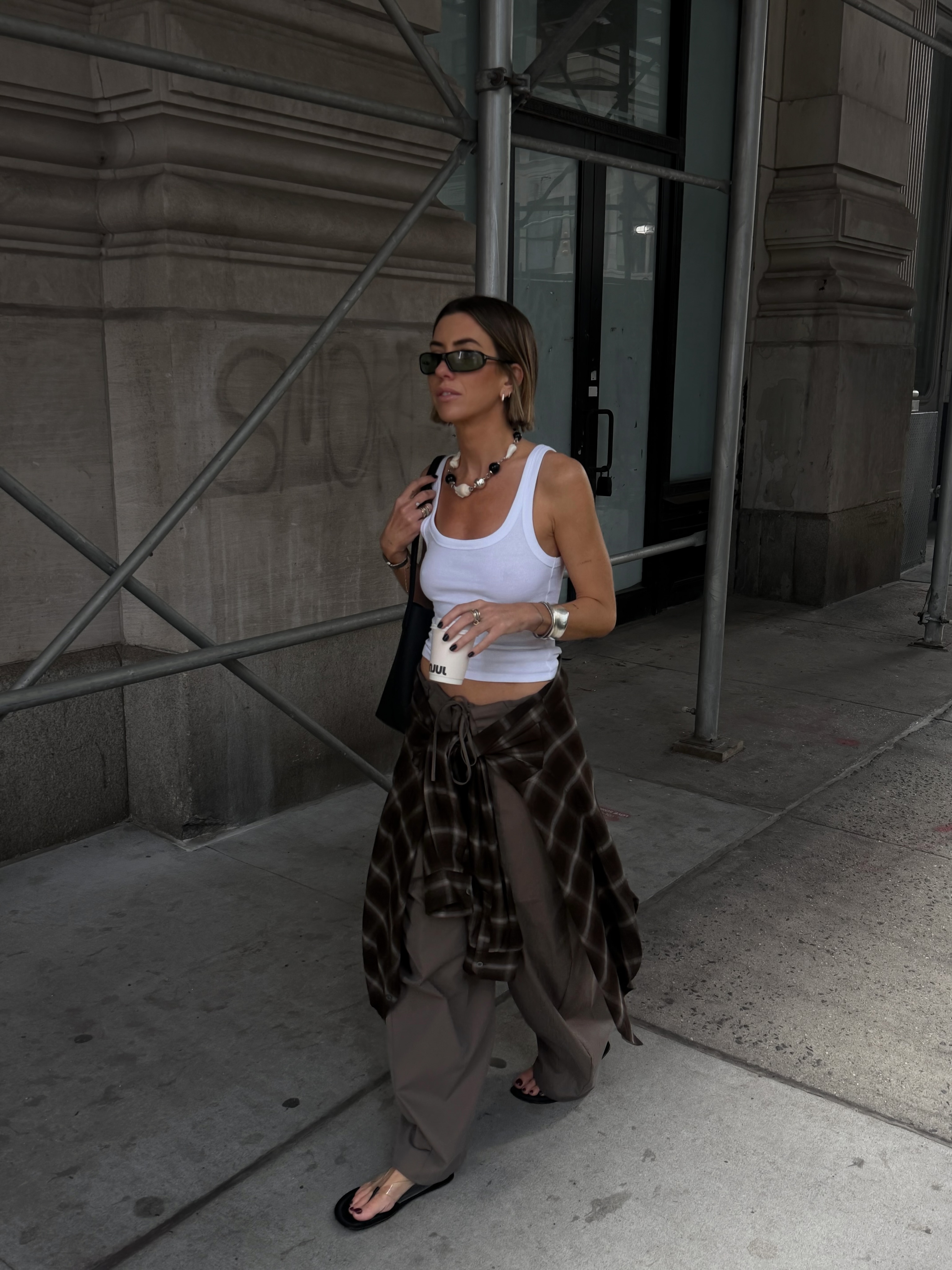Hannah in cargos and white vest