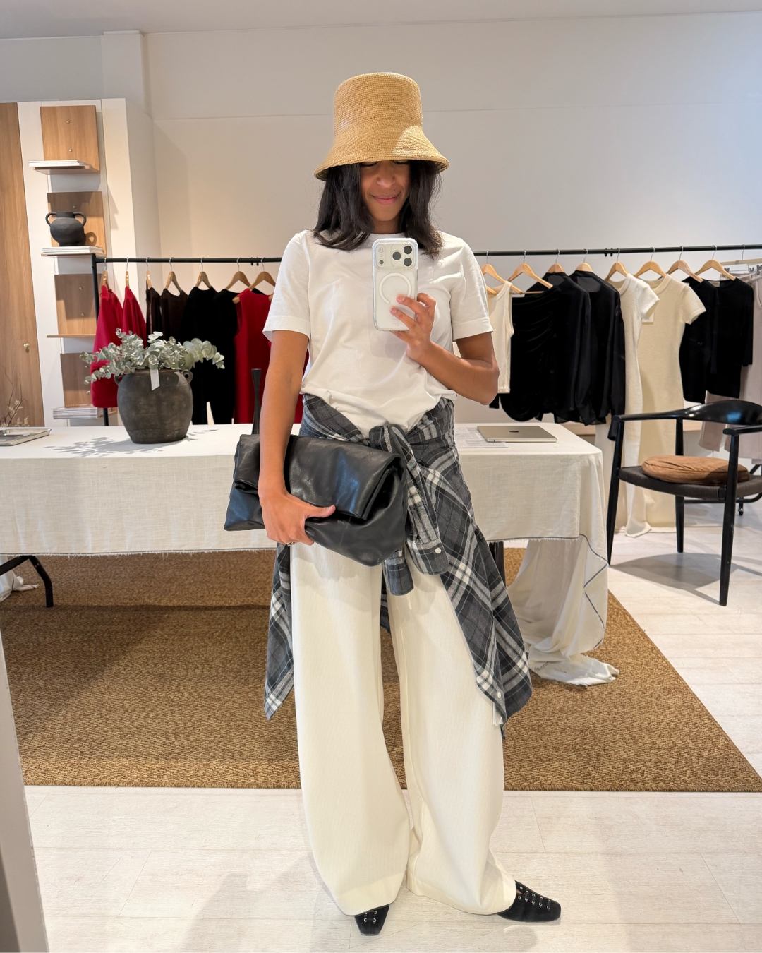 Cathy Karuga wearing a raffia bucket hat.