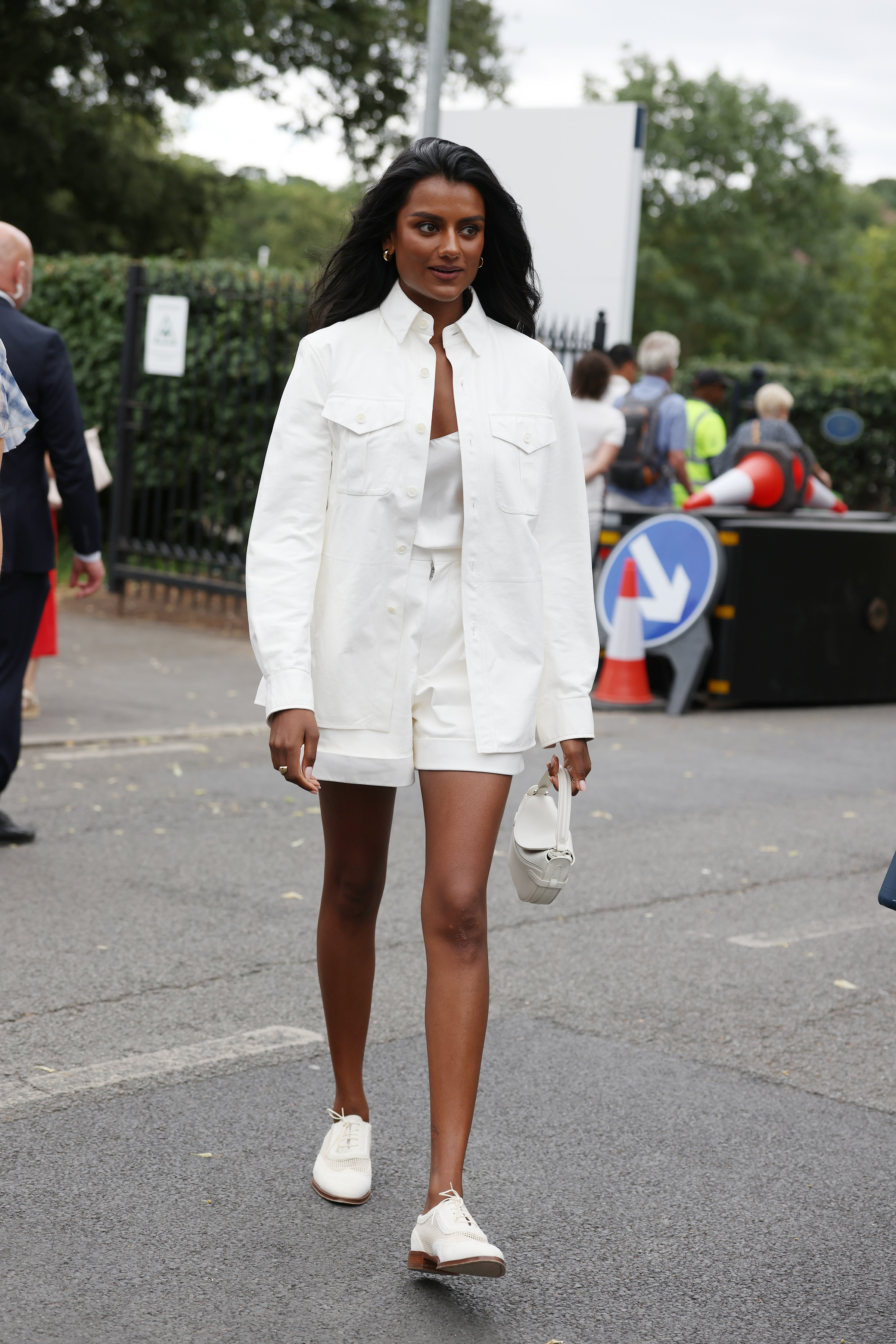 An image of Simone Ashley wearing the jazz shoe trend to Wimbledon in 2026.