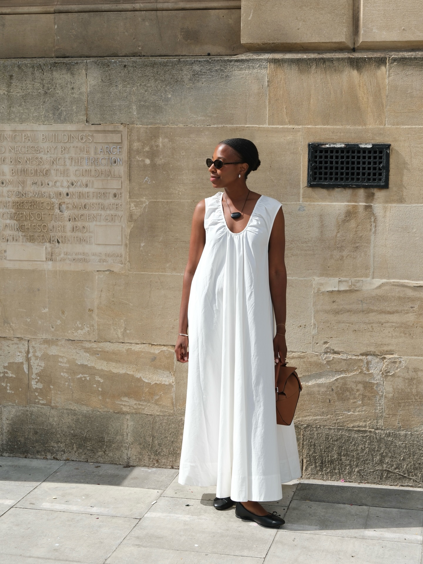 Taffy in white maxi dress and black flats