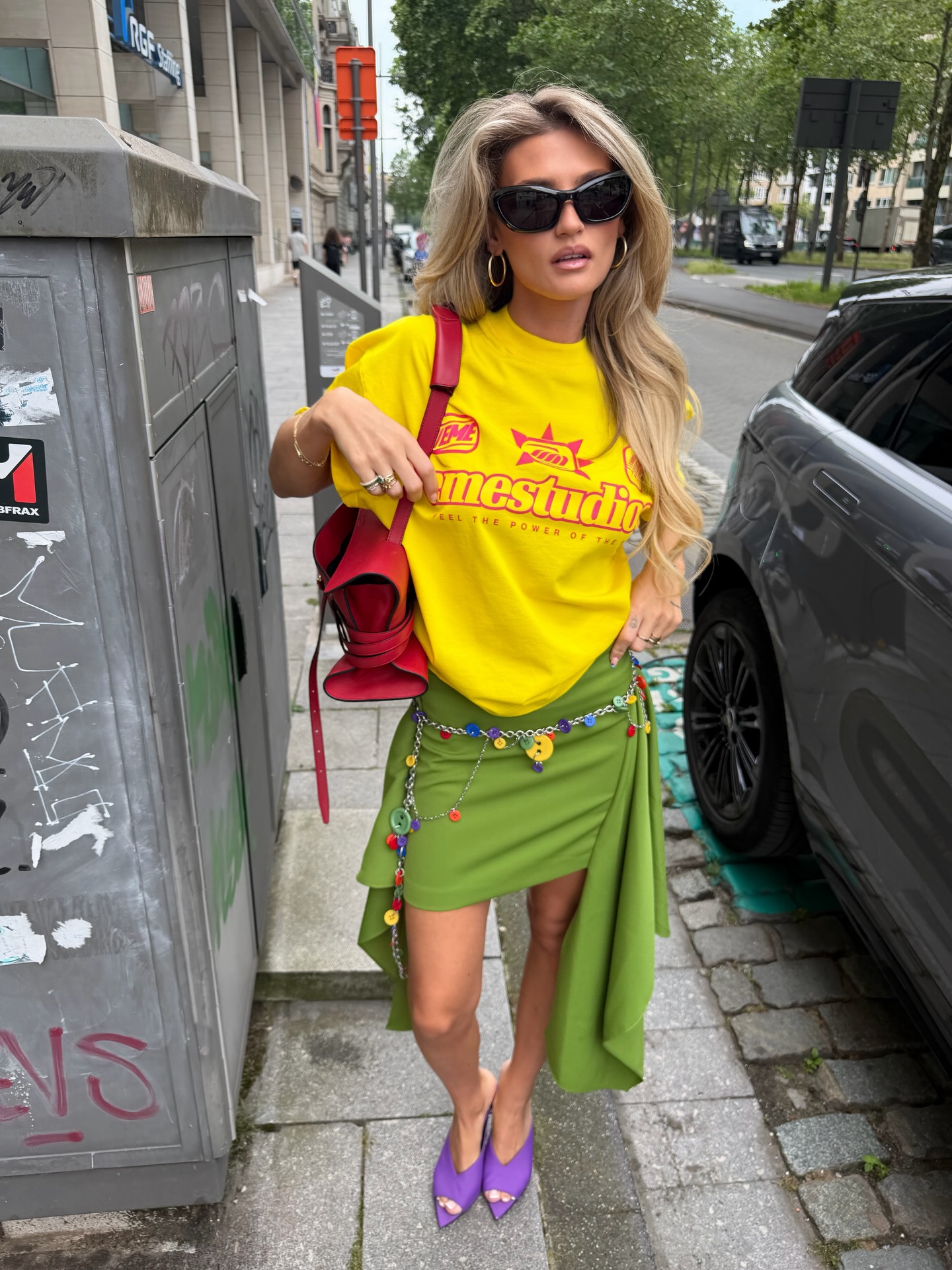 An image of a woman wearing asymmetric skirt outfit summer 2026