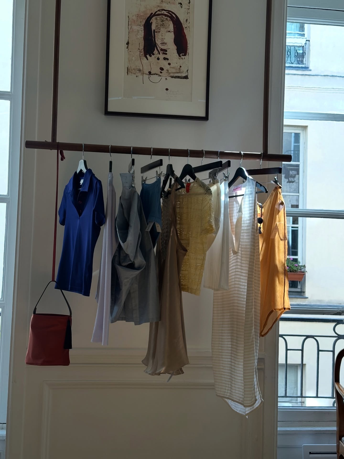 Clothes hanging on a rack in Turn's Paris store.