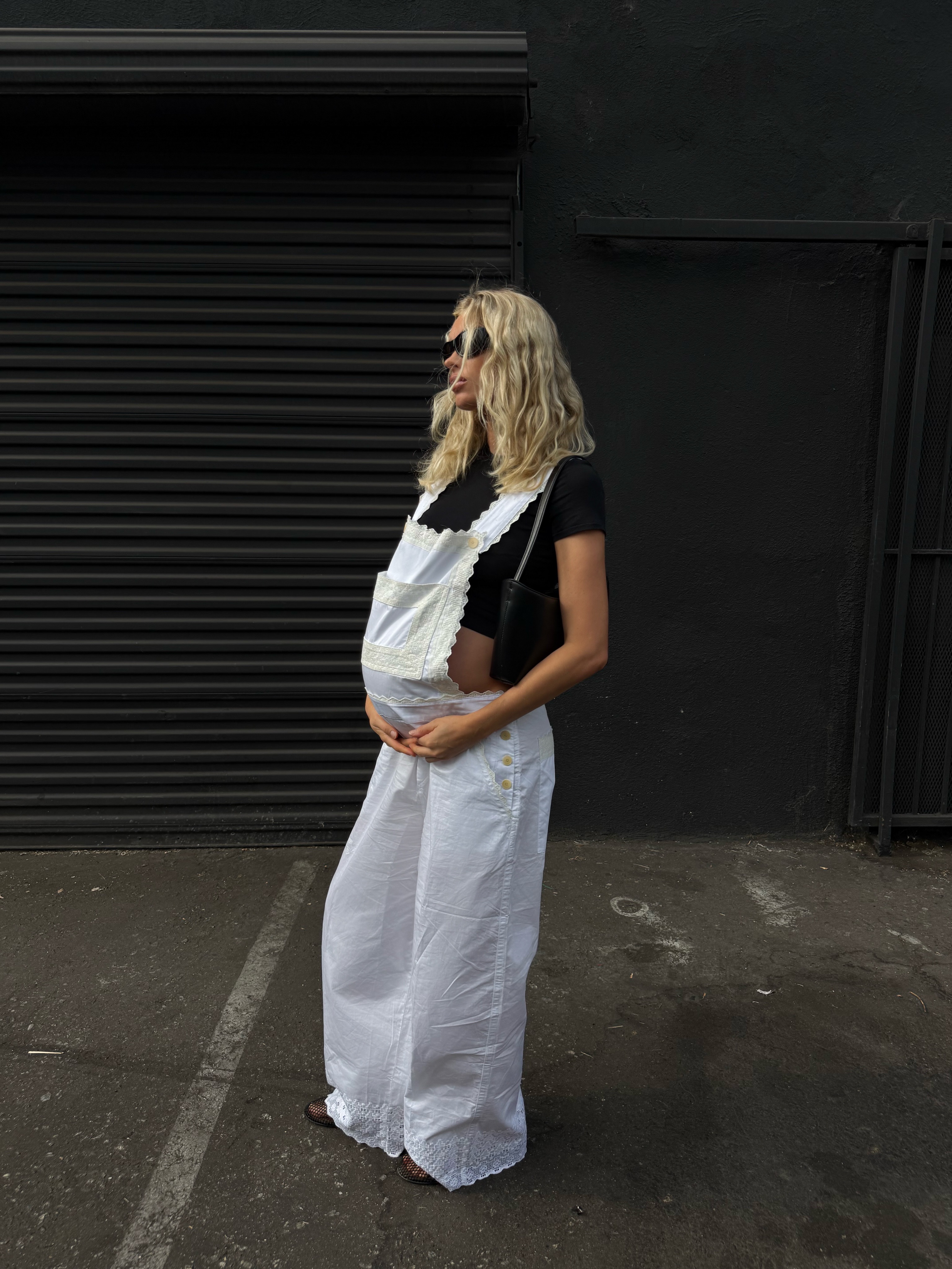 Elsa Hosk in white embroidered Helsa overalls.