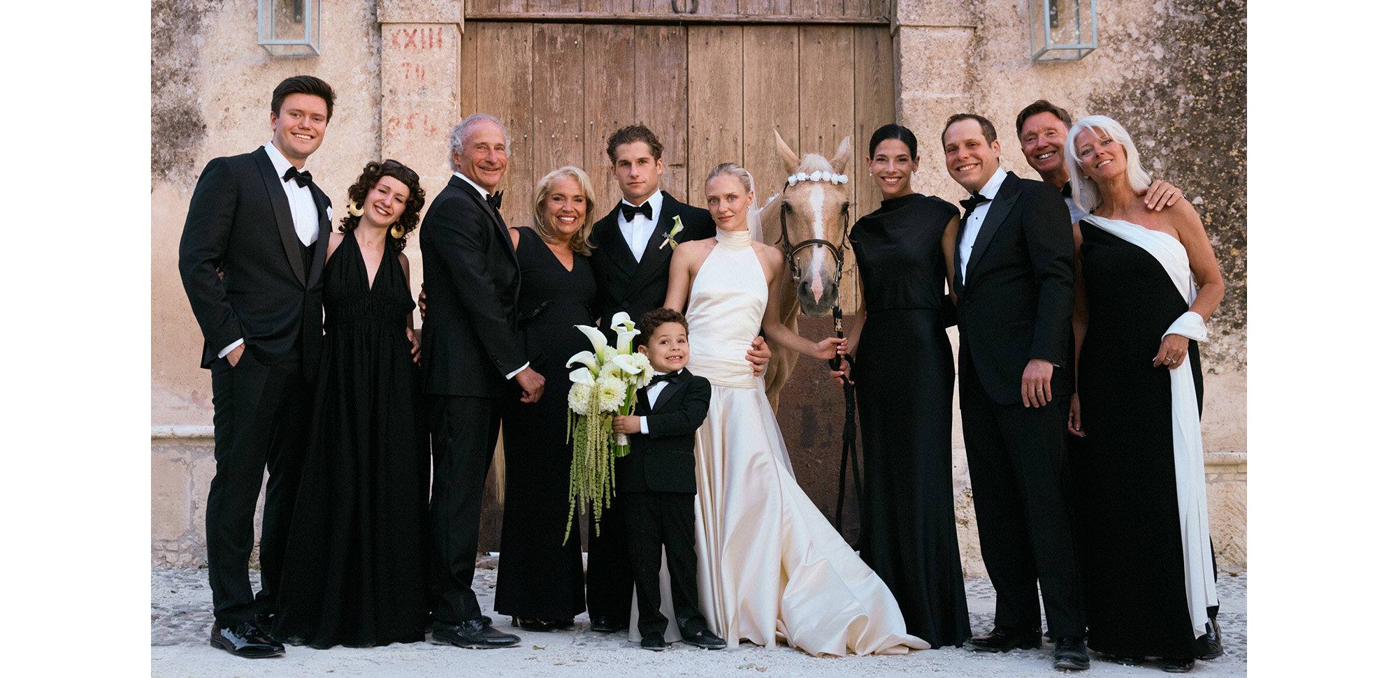 Max and Karoline posing with their families.