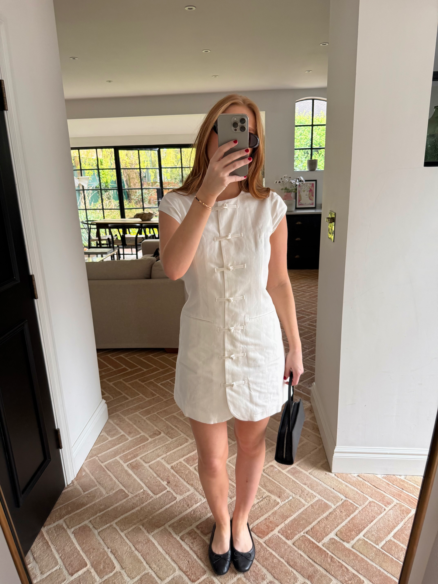 Woman wears white tie-front Aligne dress