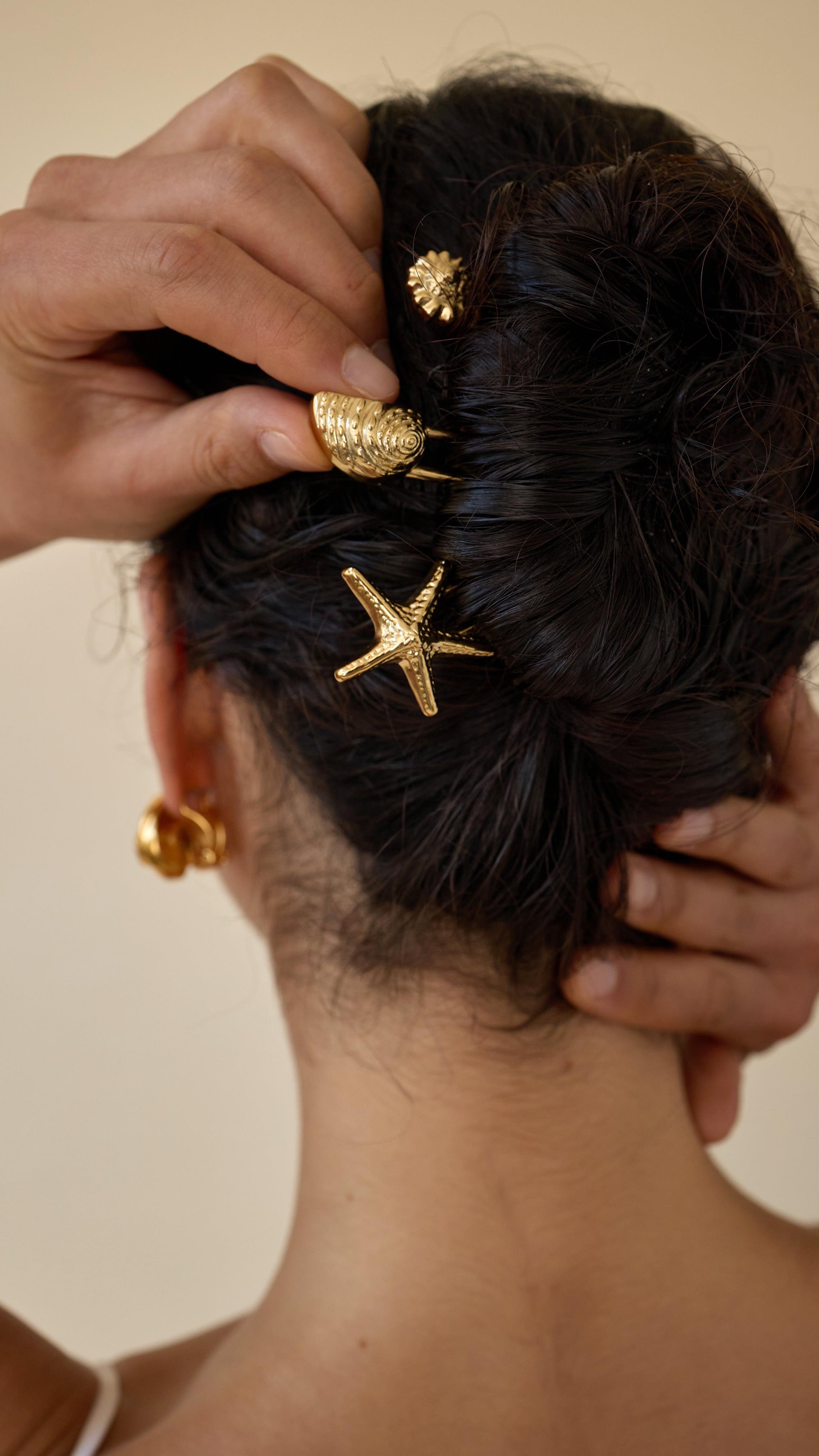 Photo of a woman wearing French pins in her hair