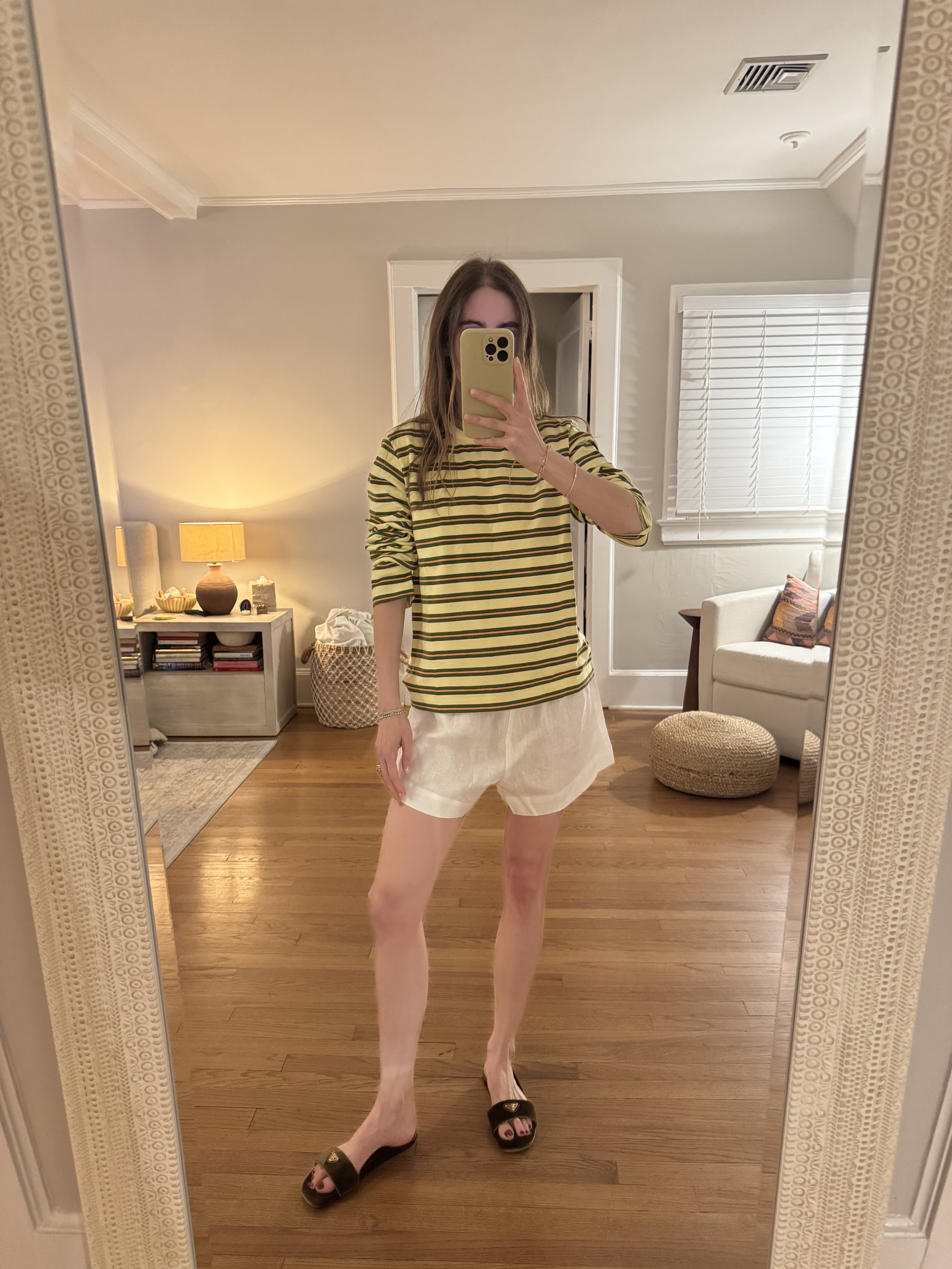 Tessa Faye O'Connell wearing white linen shorts