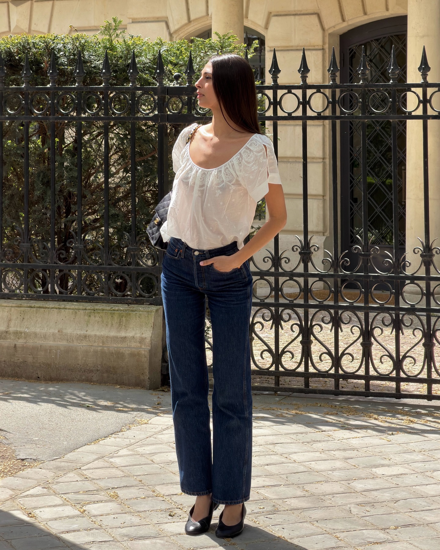 Salomé in peasant blouse and indigo jeans