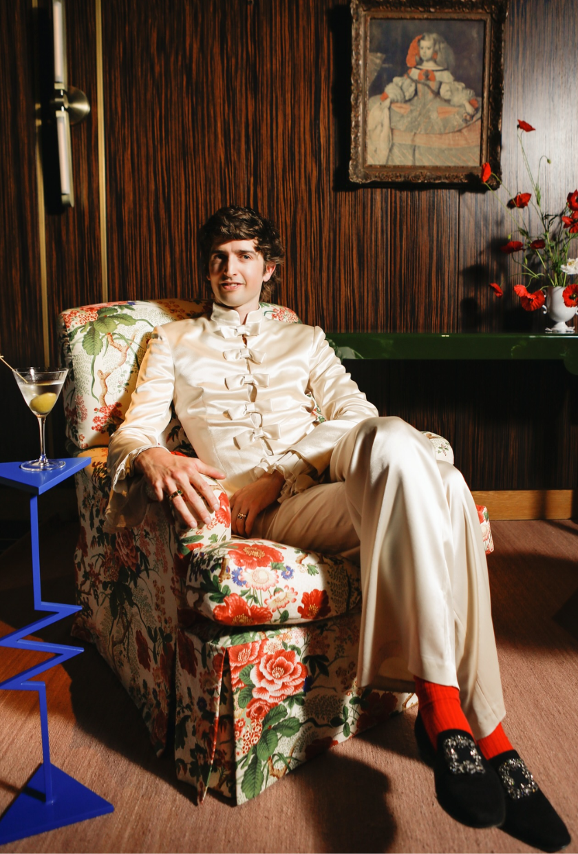 An image of @maximilianhurd sitting in his arm chair.