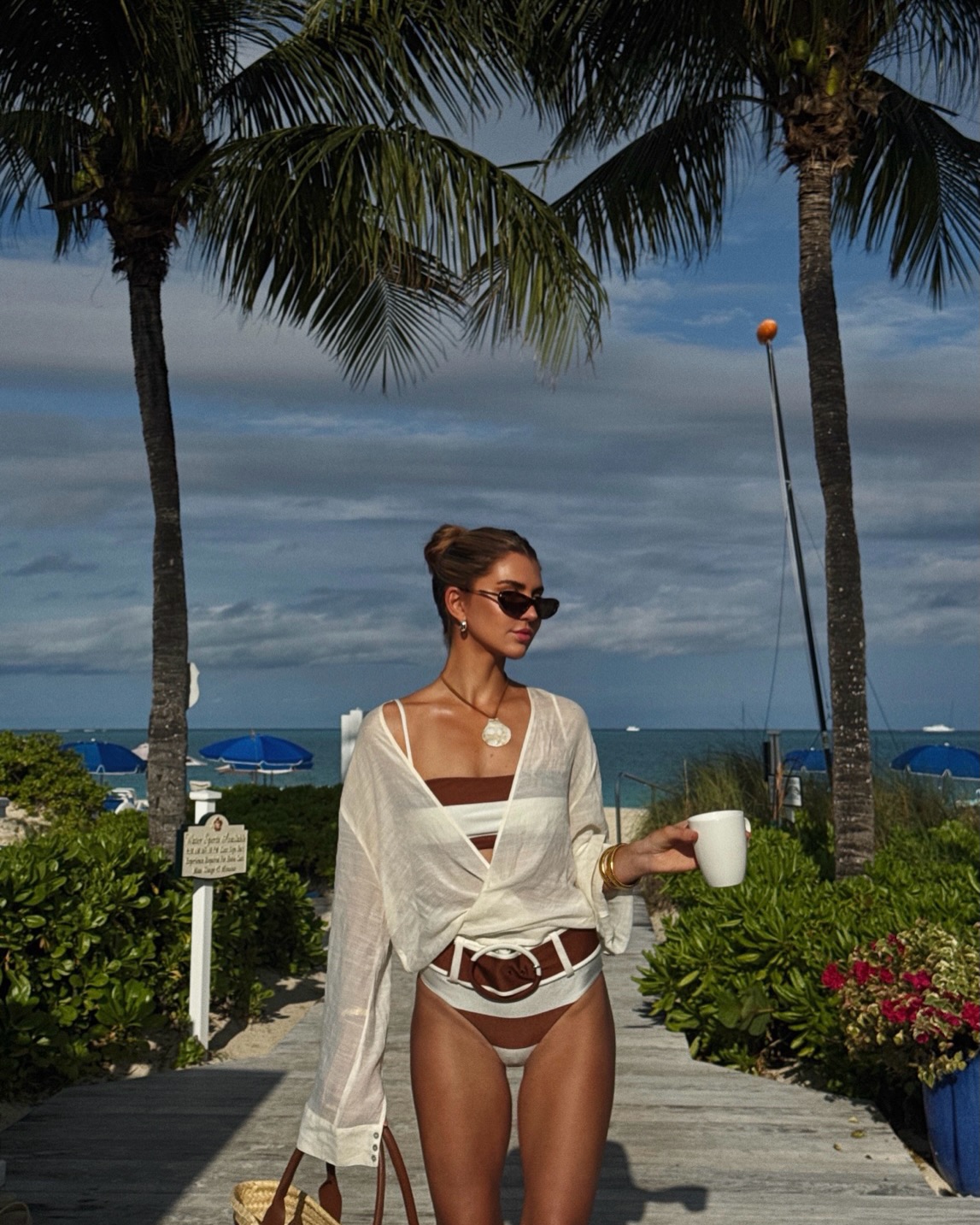 An image of a woman wearing front tie top bikini outfit summer 2026
