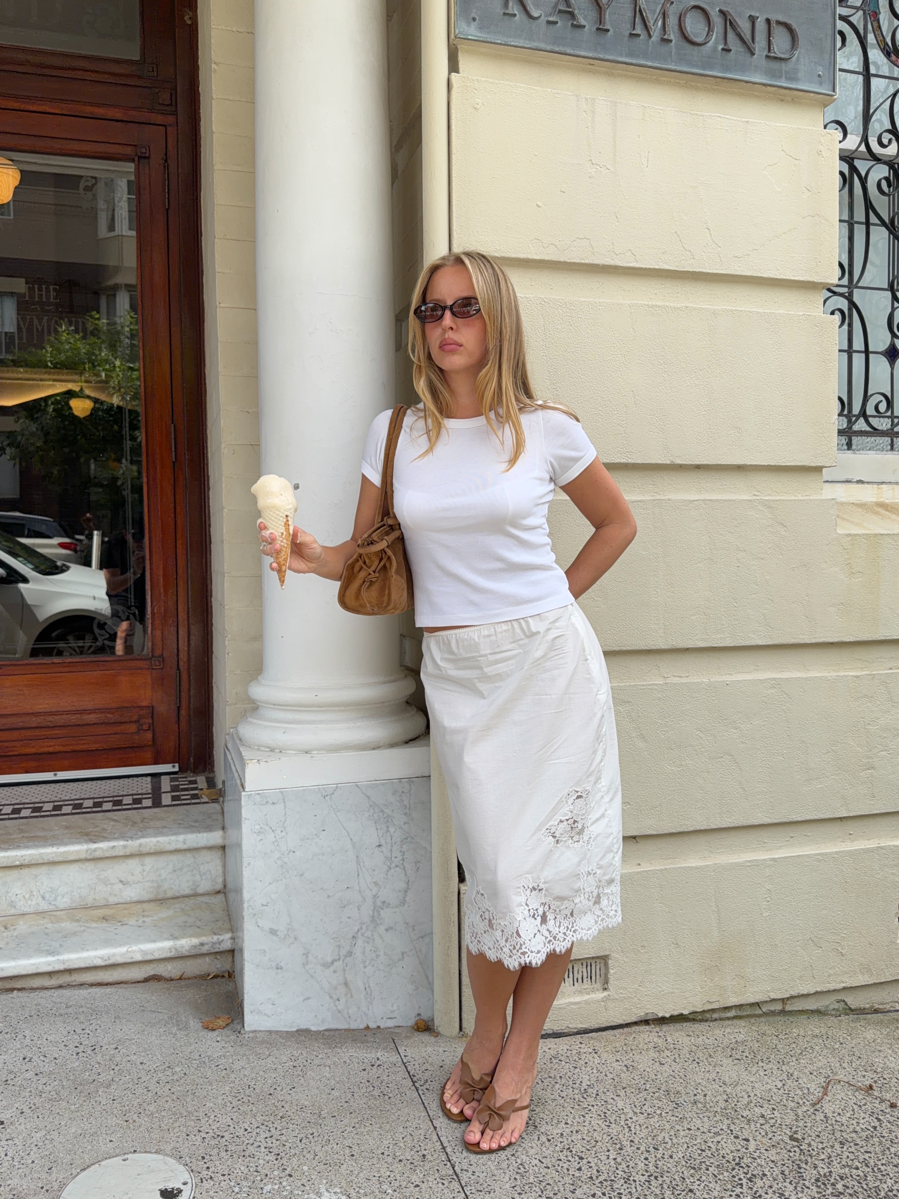 A woman wearing light-latte shoes in summer 2026.