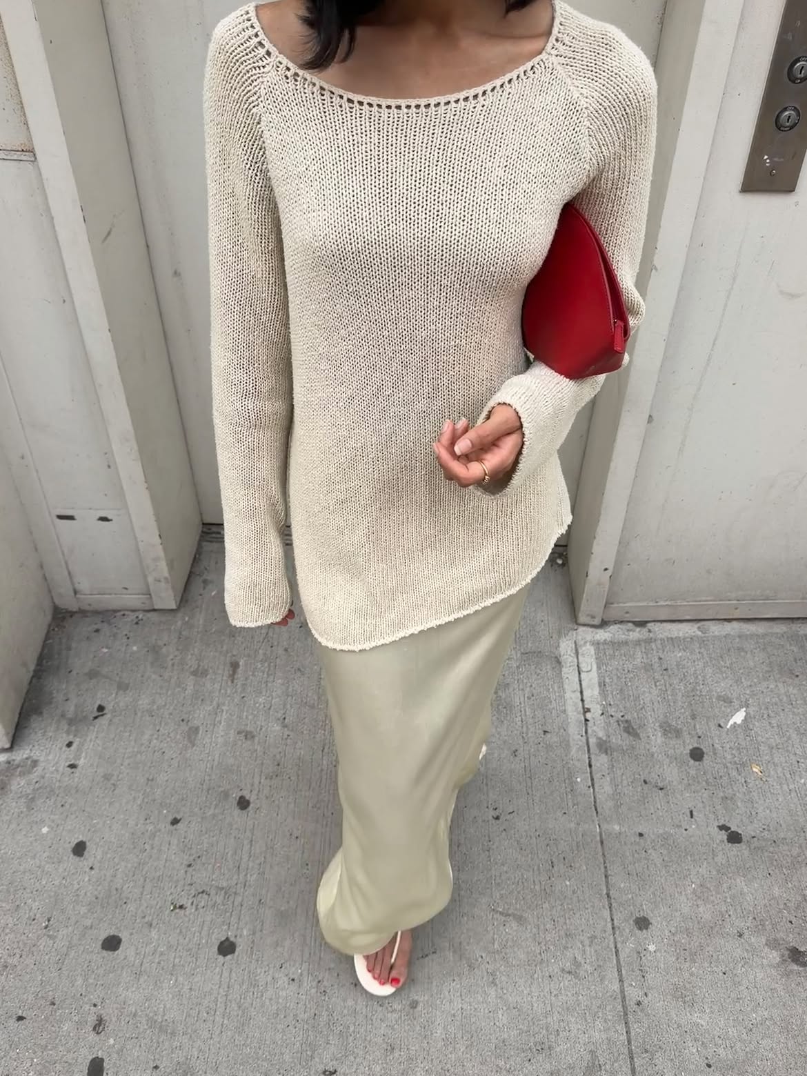 Shay June wearing a Khaite open-knit summer sweater