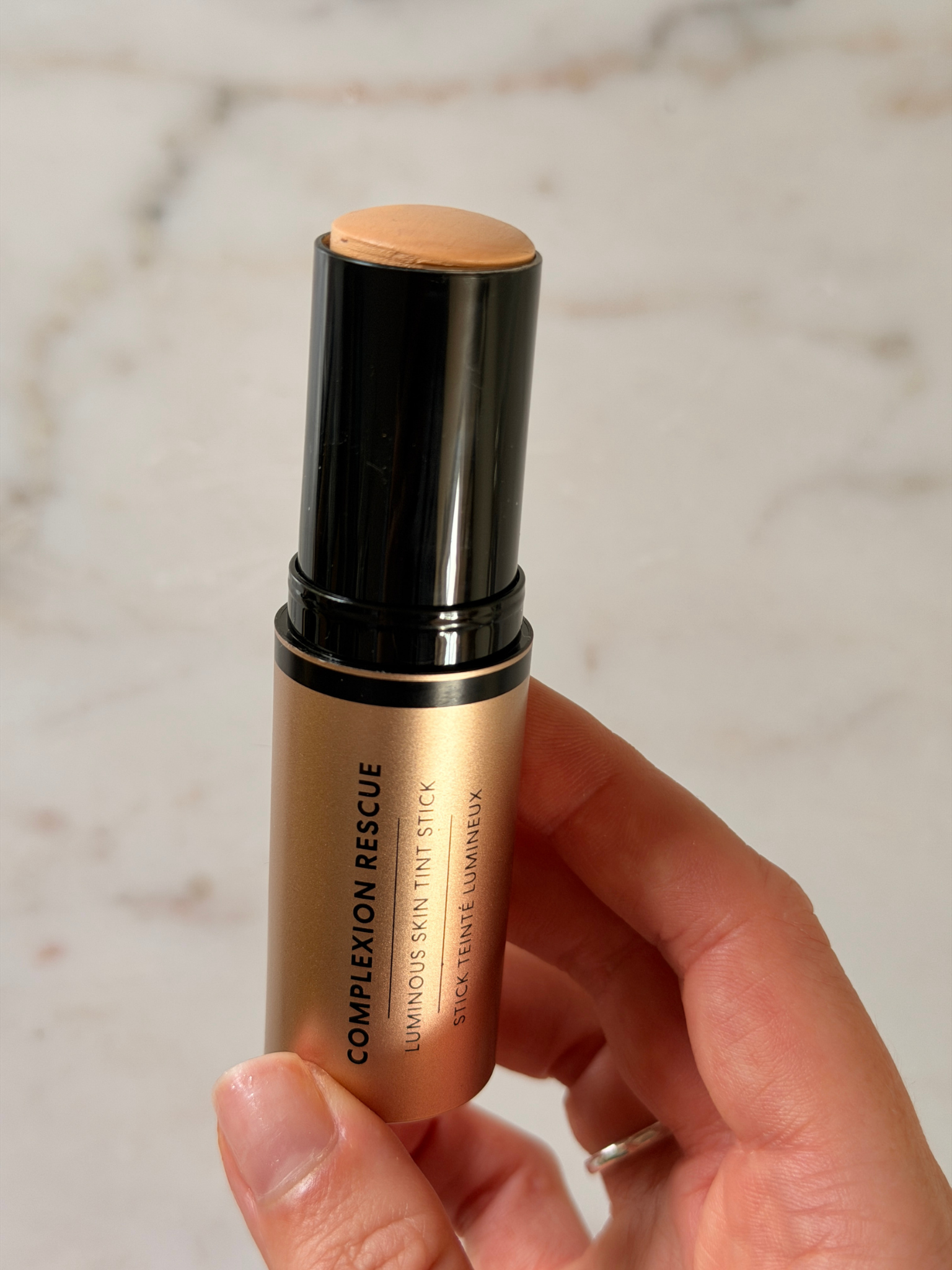 Grace Day holding the Bare Minerals foundation