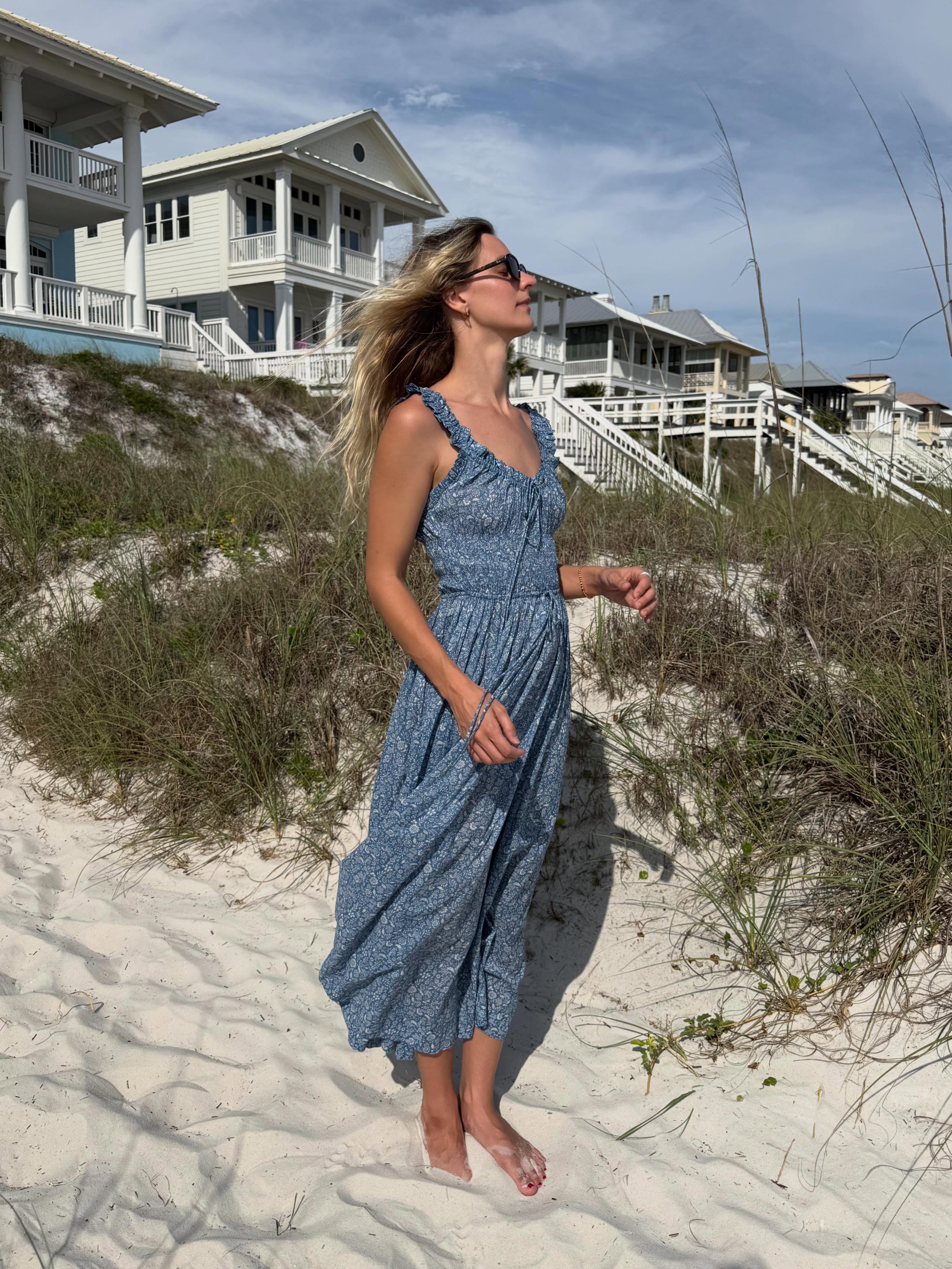 Woman wears blue Doen dress