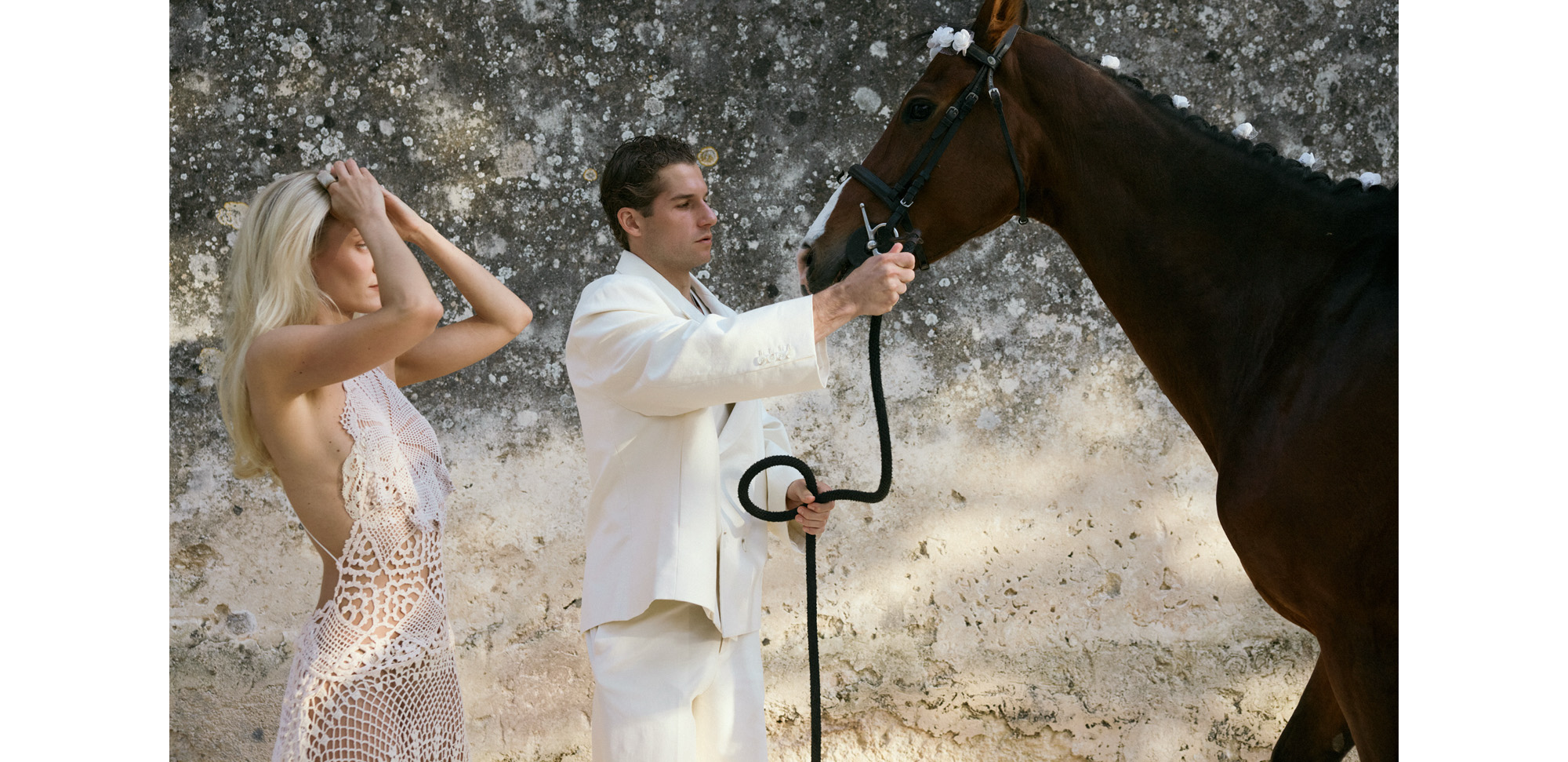 Max Siegelman and Karoline Spenning standing next to a horse.