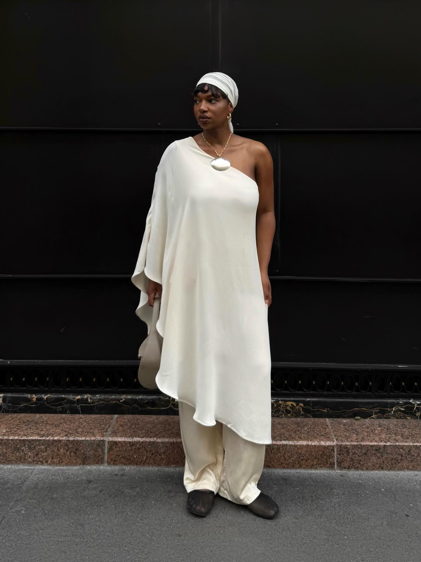 Grace in satin trousers and cape top
