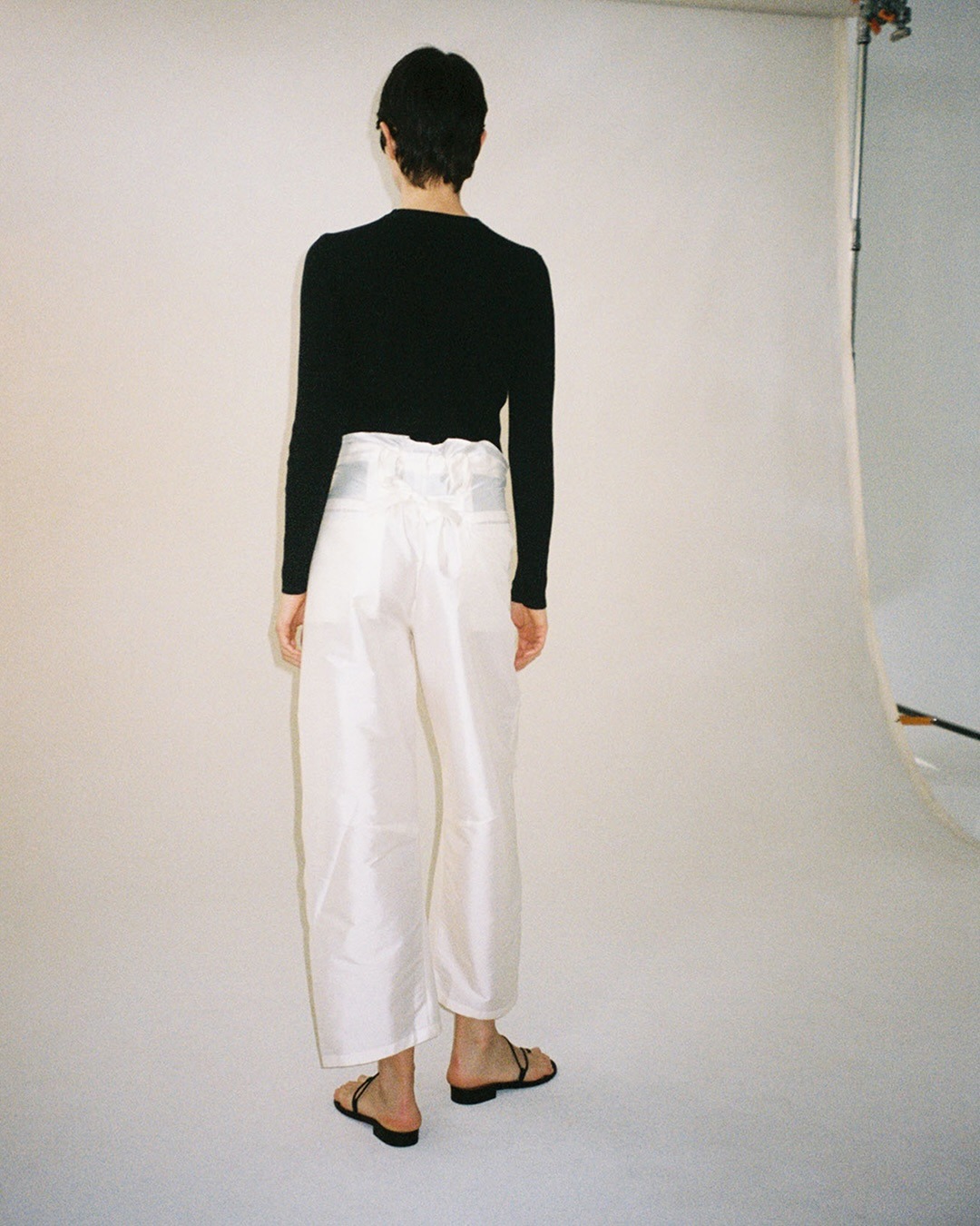 Model wearing Chan Luu taffeta pants.