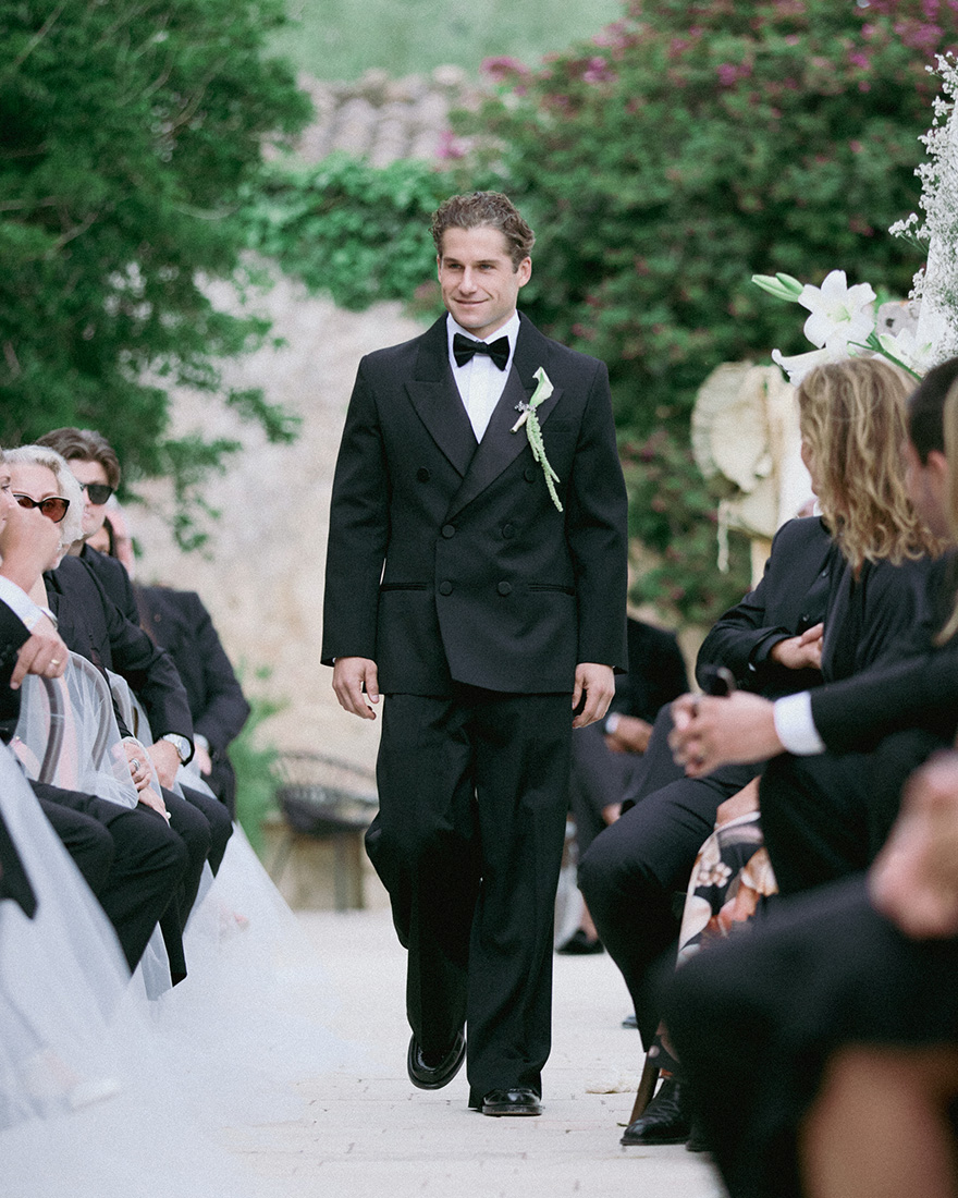 Max walking down the aisle during the ceremony.