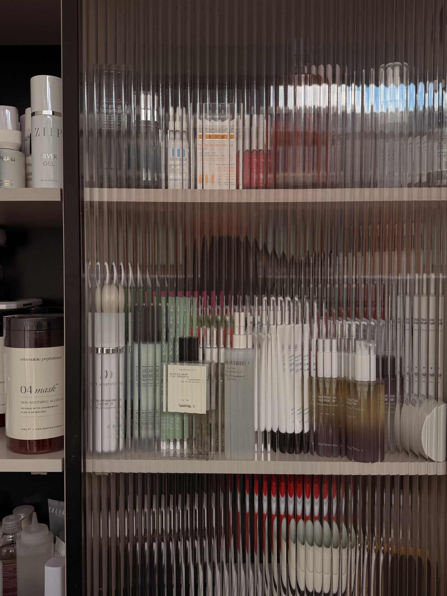 A cabinet of skincare products