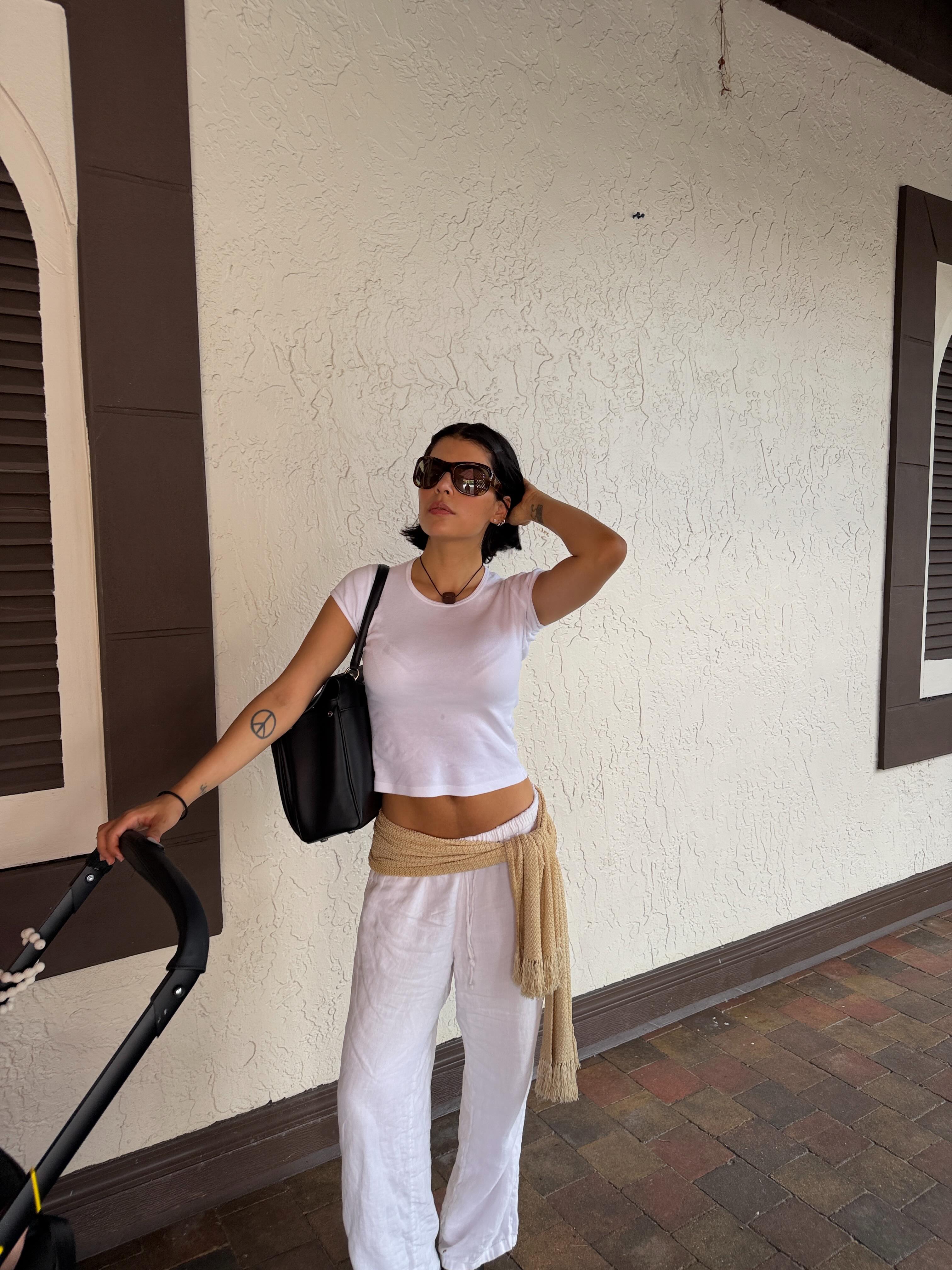 An image of a woman wearing best white linen fashion item for summer 2026