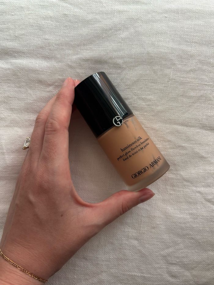 Deputy beauty editor Grace Lindsay holding the Giorgio Armani Luminous Silk Foundation