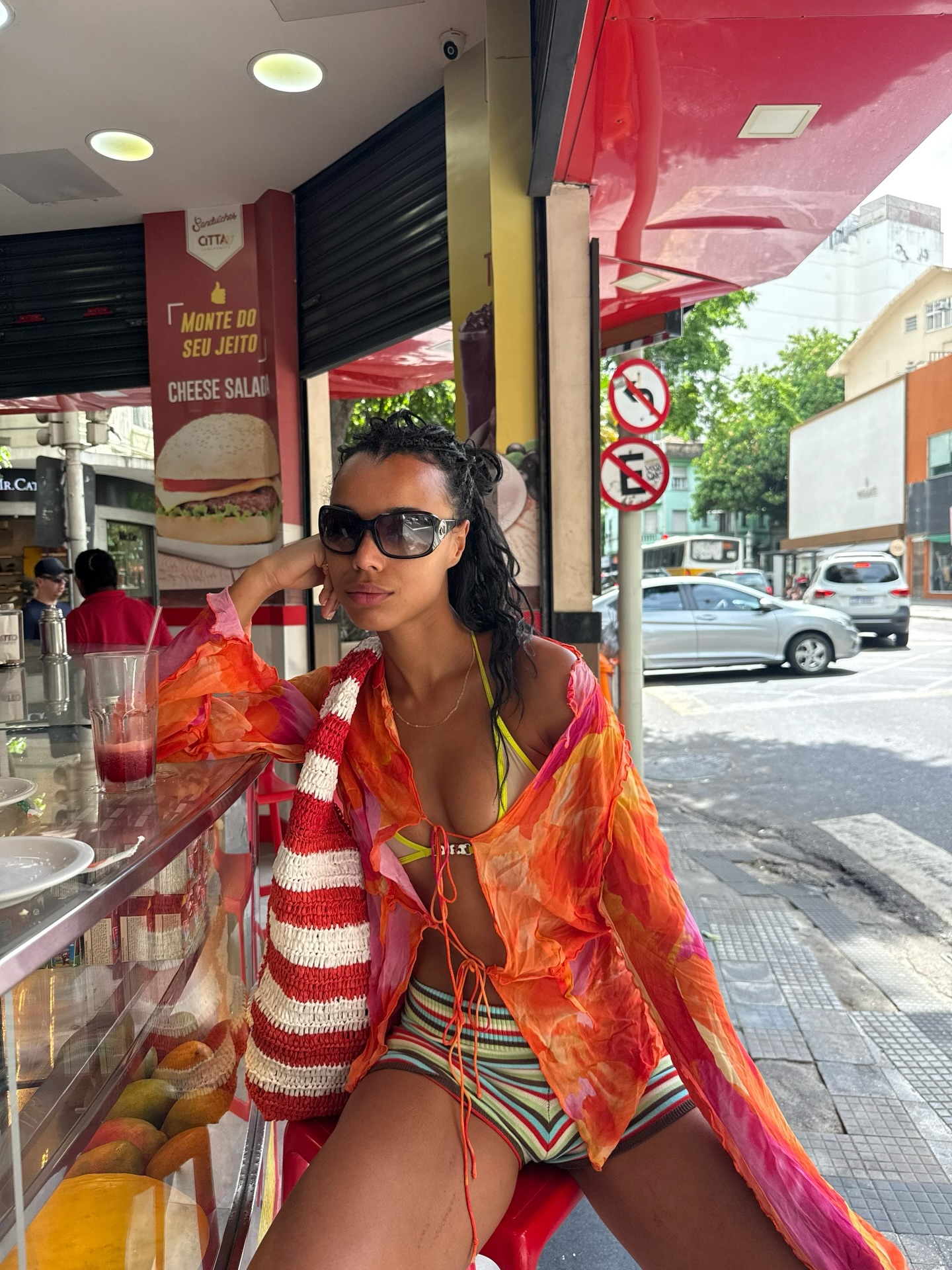 An image of a woman wearing front tie top bikini outfit summer 2026