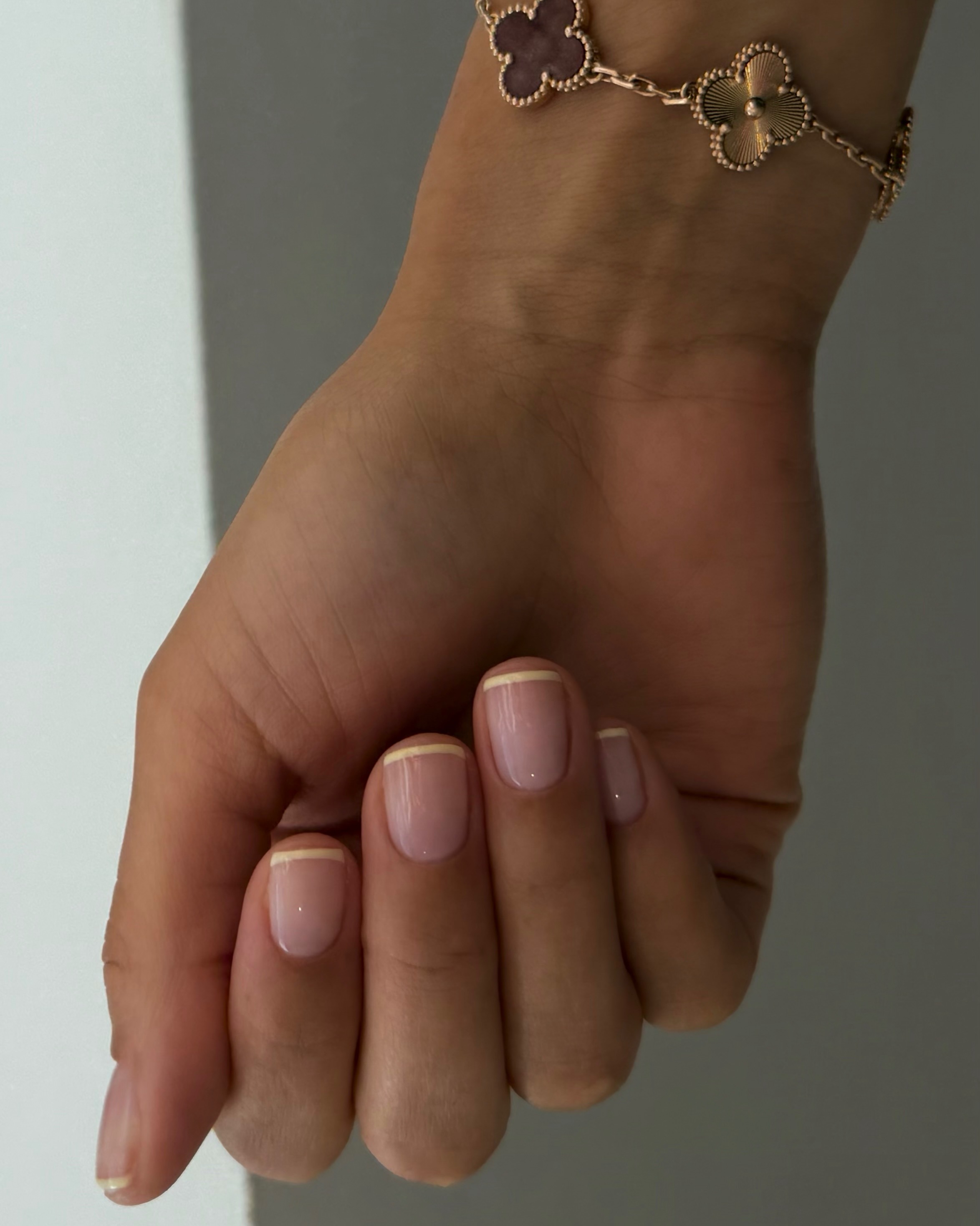 A butter yellow French tip manicure