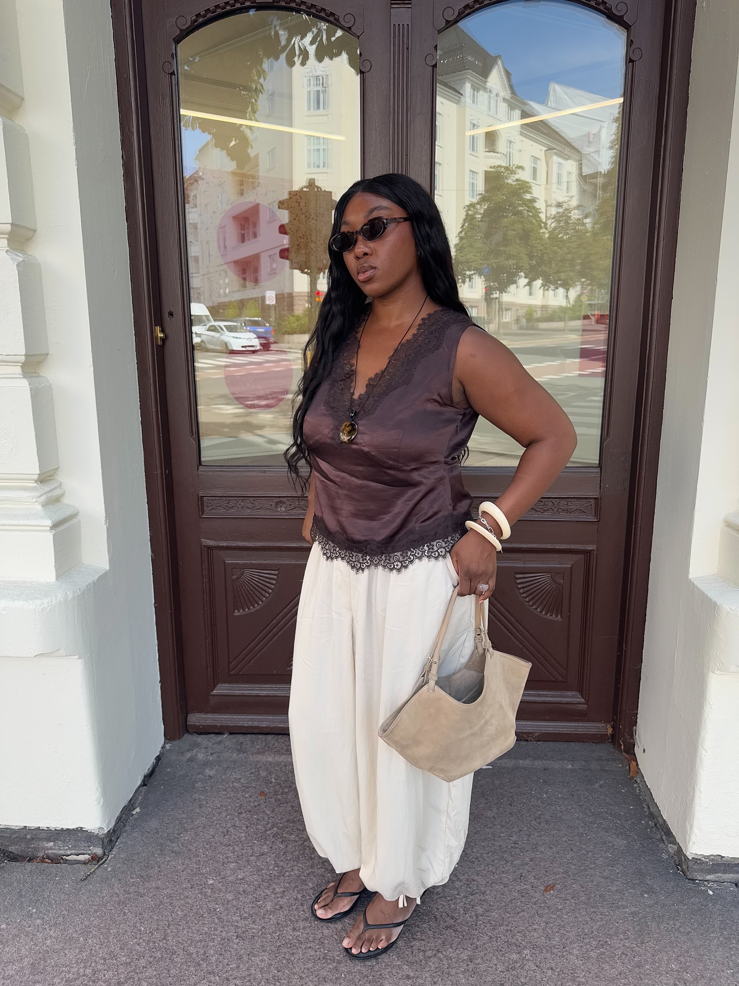 @nnennaechem wearing balloon trousers with It-girl shoe trends for summer 2026
