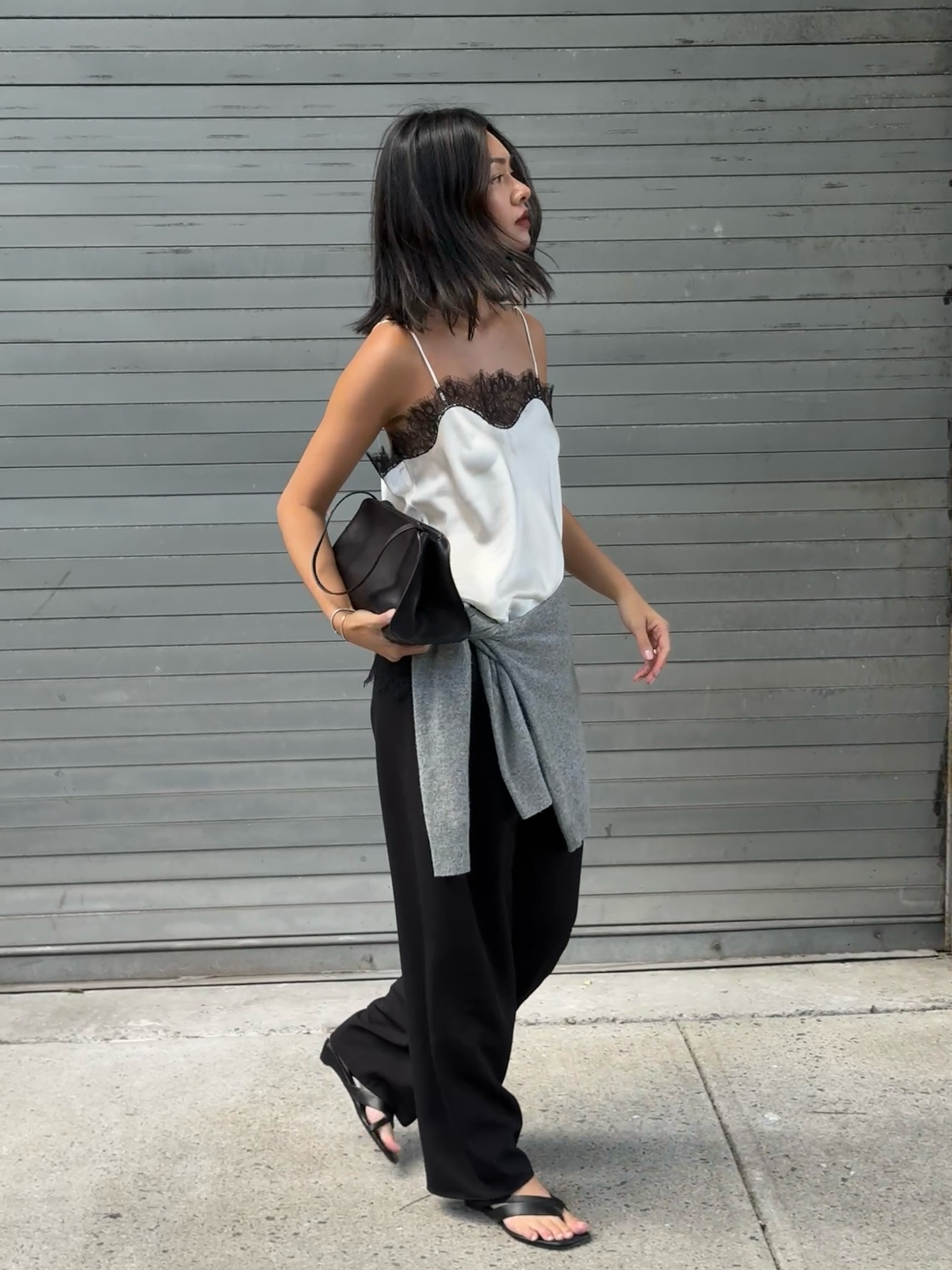 Mimi Nguyen wears a  Camisole + Tailored Trousers + Sandals